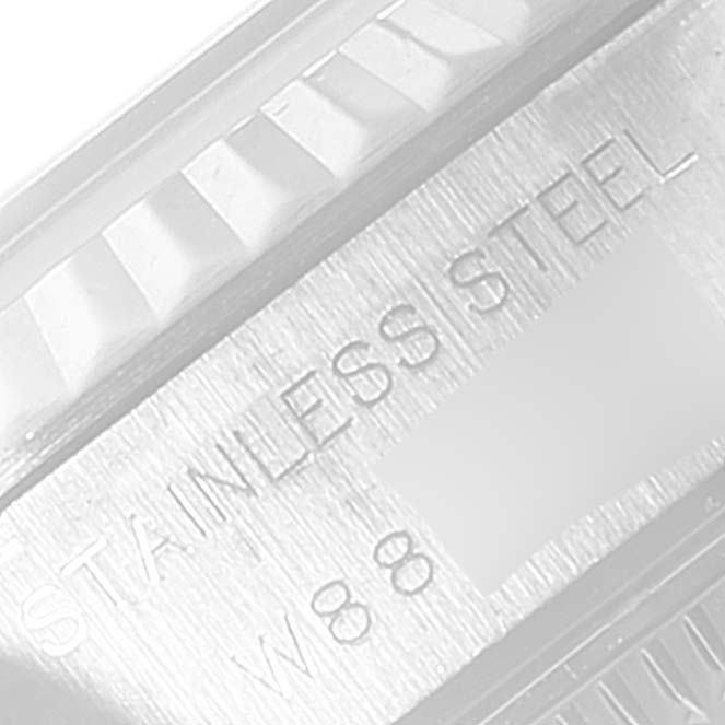 The image shows a close-up of the side of a Rolex Datejust 69174 Women
s Stainless Steel Black Dial 69174 Women
s Stainless Steel Black Dial watch, highlighting the stainless steel material and some engraved text.
