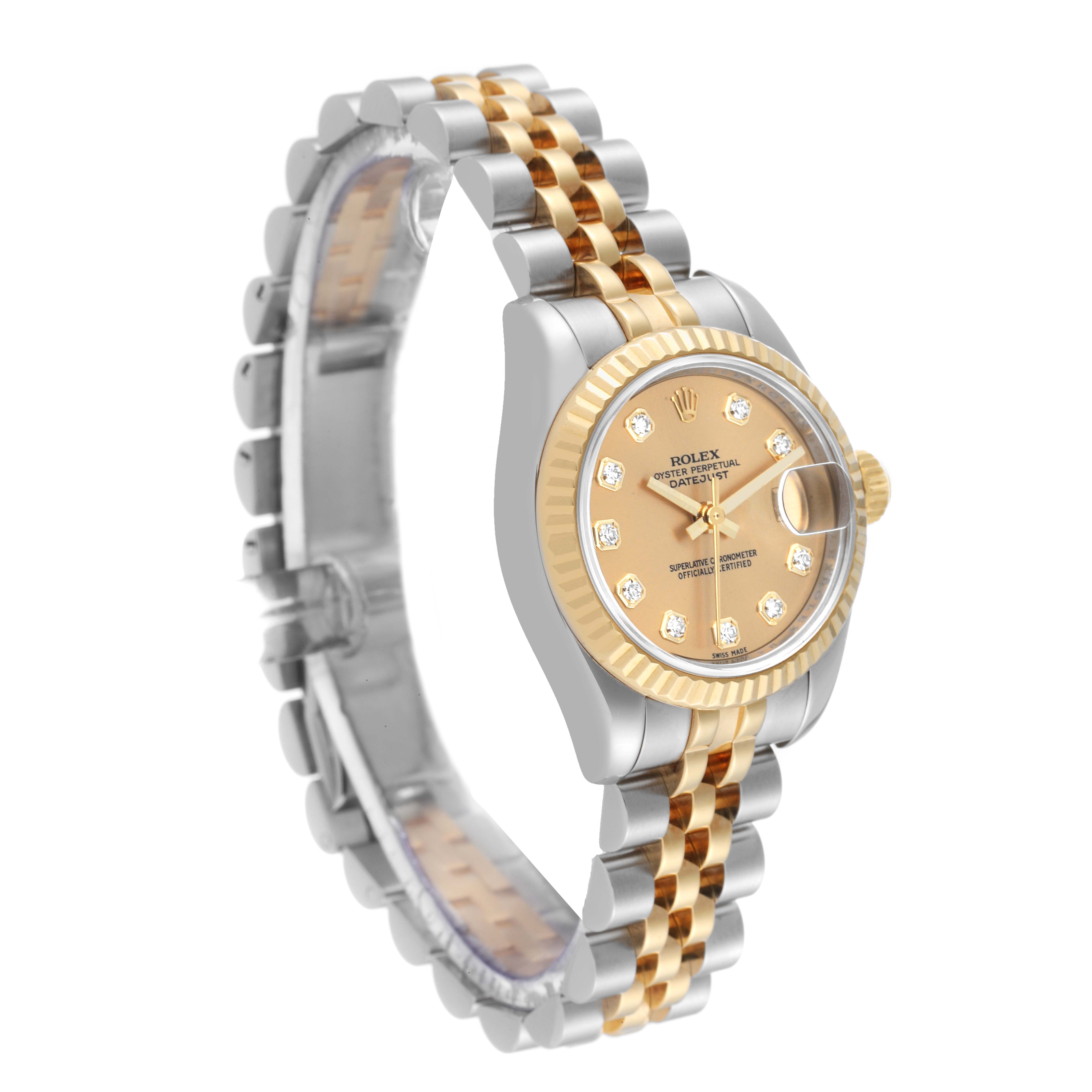 This Rolex Datejust 179173 Women's Steel and Gold (two tone) Champagne Dial 179173 Women's Steel and Gold (two tone) Champagne Dial watch is shown at an angle displaying the face, bezel, and two-tone bracelet.