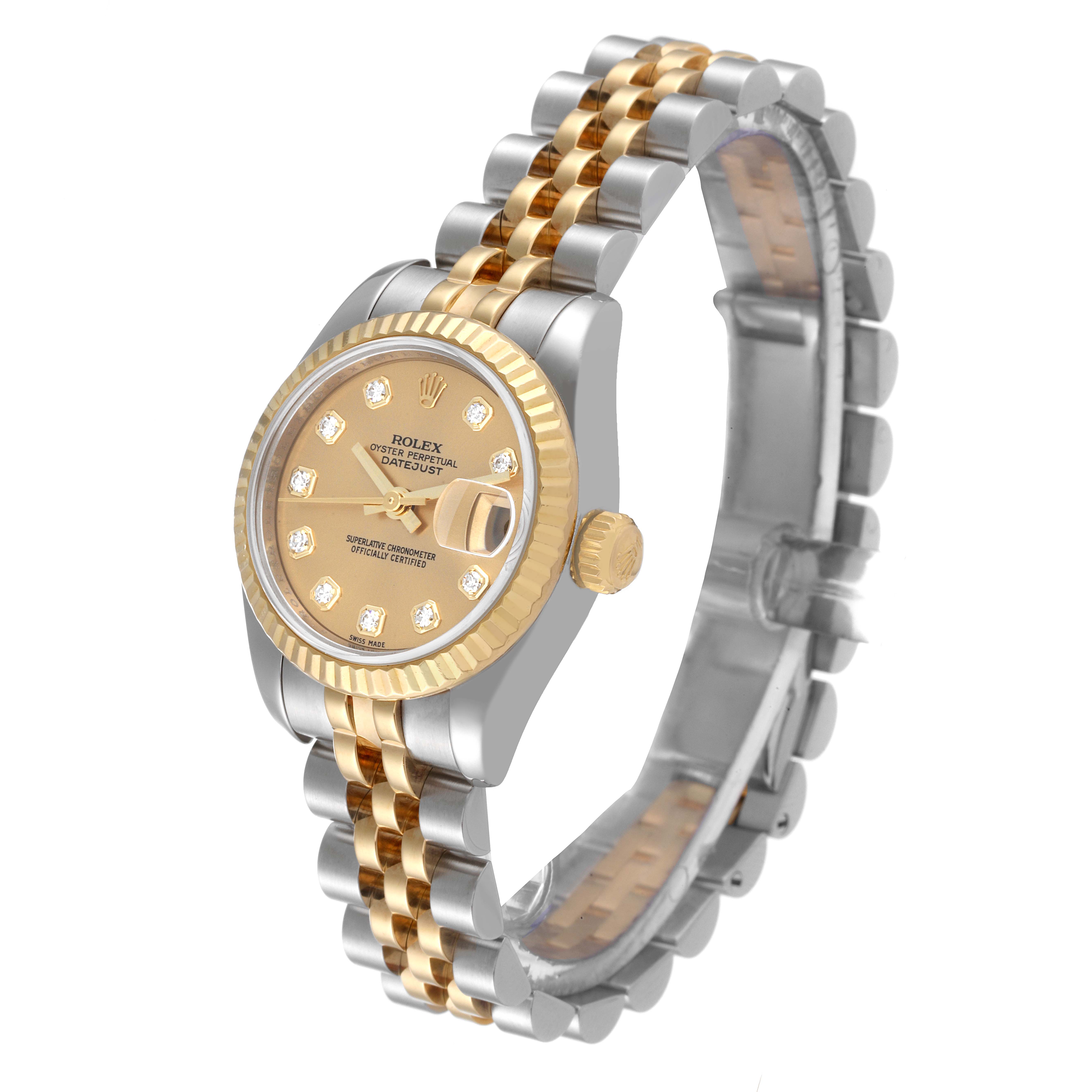 The image shows a side and front view of a Rolex Datejust 179173 Women's Steel and Gold (two tone) Champagne Dial 179173 Women's Steel and Gold (two tone) Champagne Dial watch, featuring its dial, bezel, crown, and part of its bracelet.