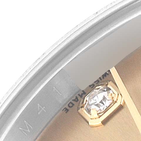The image shows a close-up of the dial edge and a diamond hour marker on a Rolex Datejust 179173 Women's Steel and Gold (two tone) Champagne Dial 179173 Women's Steel and Gold (two tone) Champagne Dial watch.