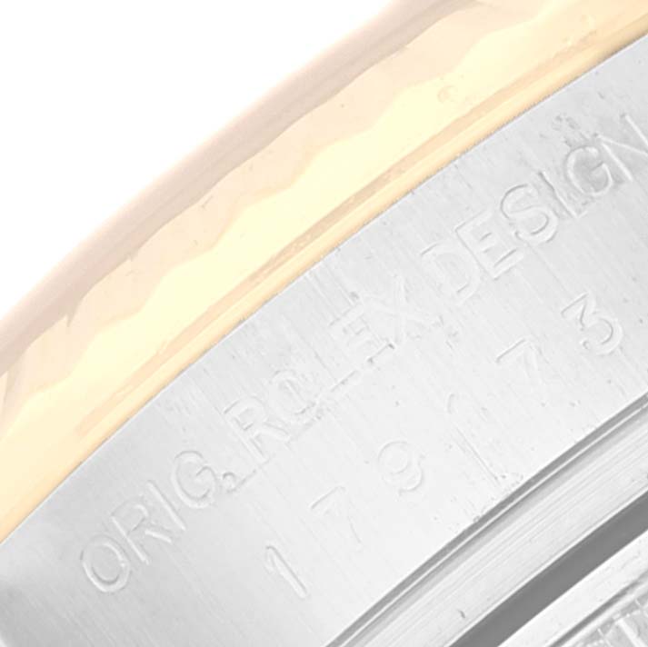 The image shows a close-up of the engraved inner case of a Rolex Datejust 179173 Women's Steel and Gold (two tone) Champagne Dial 179173 Women's Steel and Gold (two tone) Champagne Dial watch, including part of the model number.