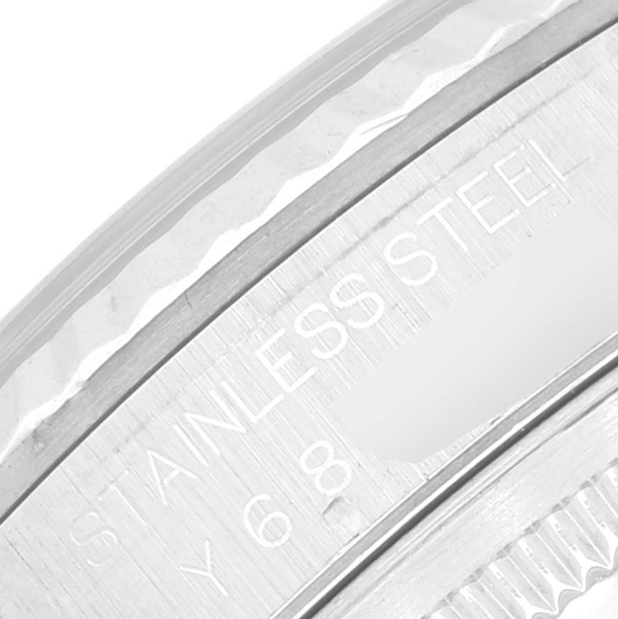 This image shows a close-up of the engraved stainless steel case back of a Rolex Datejust 16234 Men's Stainless Steel Black Dial 16234 Men's Stainless Steel Black Dial watch.