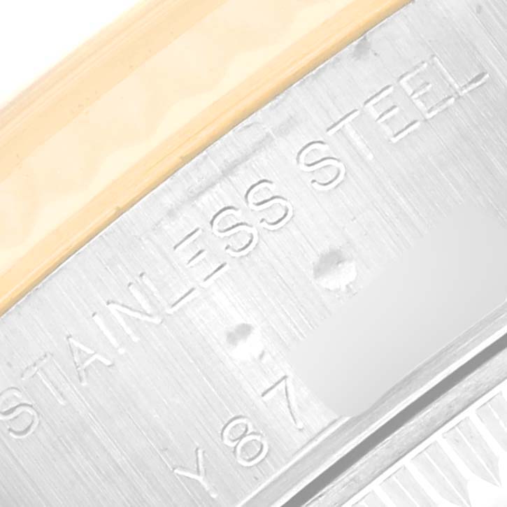 This close-up image shows the engraved markings, including the model number, on the side of the Rolex Datejust 79173 Women's Steel and Gold (two tone) Mother of Pearl Dial 79173 Women's Steel and Gold (two tone) Mother of Pearl Dial watch case.