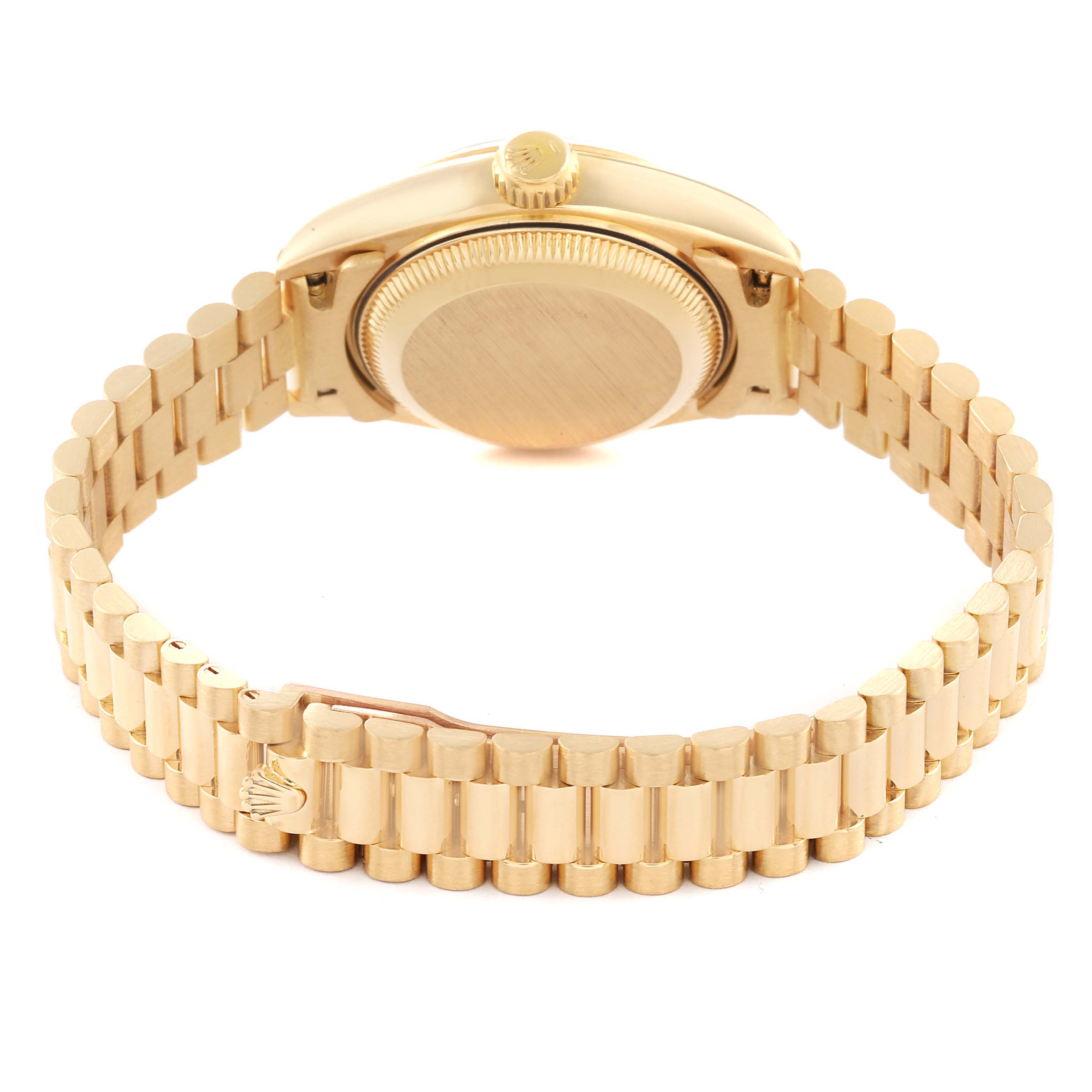 This image shows the back and the bracelet of a gold Rolex President 69178 Women
s Yellow Gold Champagne Dial 69178 Women
s Yellow Gold Champagne Dial model watch from a low rear angle.