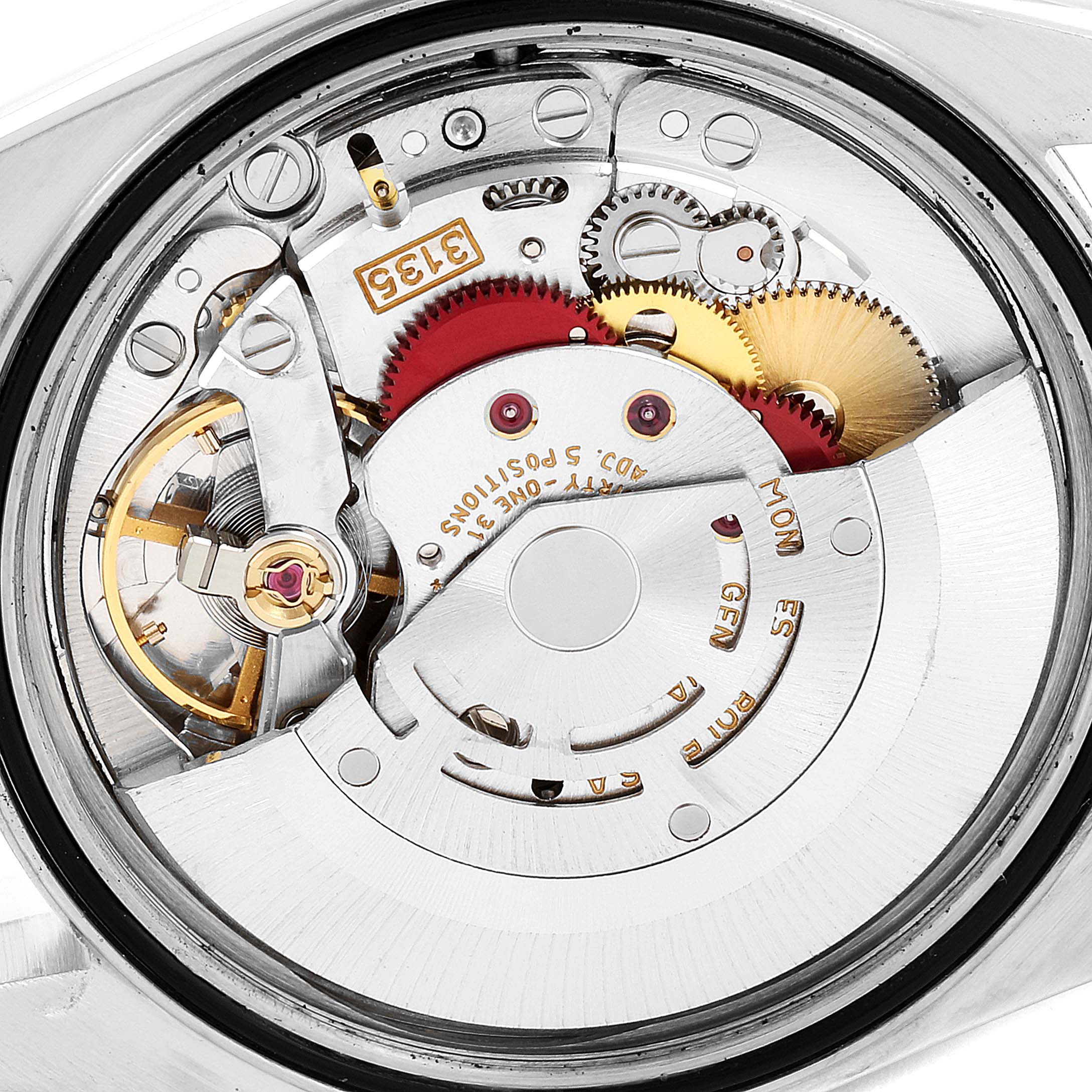 The image shows a close-up view of the movement and internal mechanics of a Rolex Datejust 16233 Men's Steel and Gold (two tone) Silver Dial 16233 Men's Steel and Gold (two tone) Silver Dial watch.