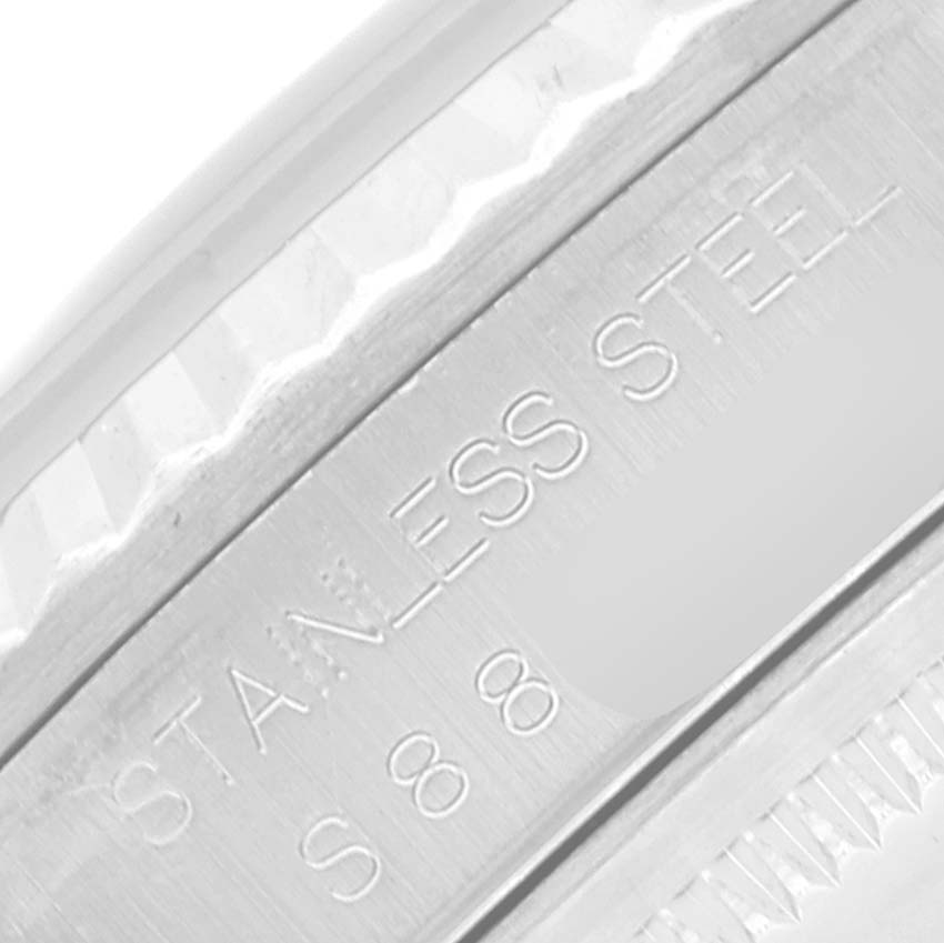 This close-up image shows the "STAINLESS STEEL" engraving on the Datejust model by Rolex.