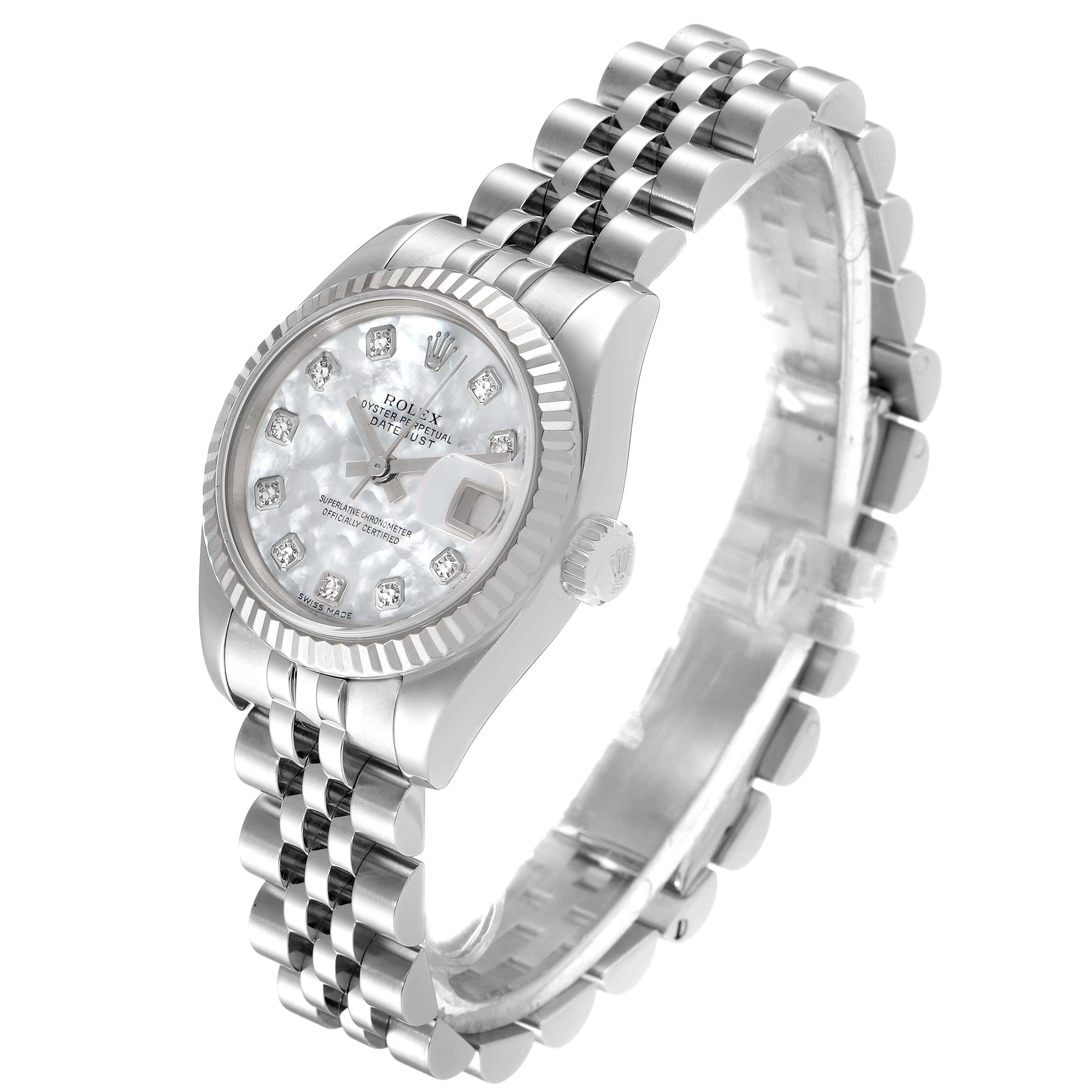 The image shows a Rolex Datejust 179174 Women
s Stainless Steel Mother of Pearl Dial 179174 Women
s Stainless Steel Mother of Pearl Dial watch from an angled side view, highlighting the dial, bezel, bracelet, and crown.