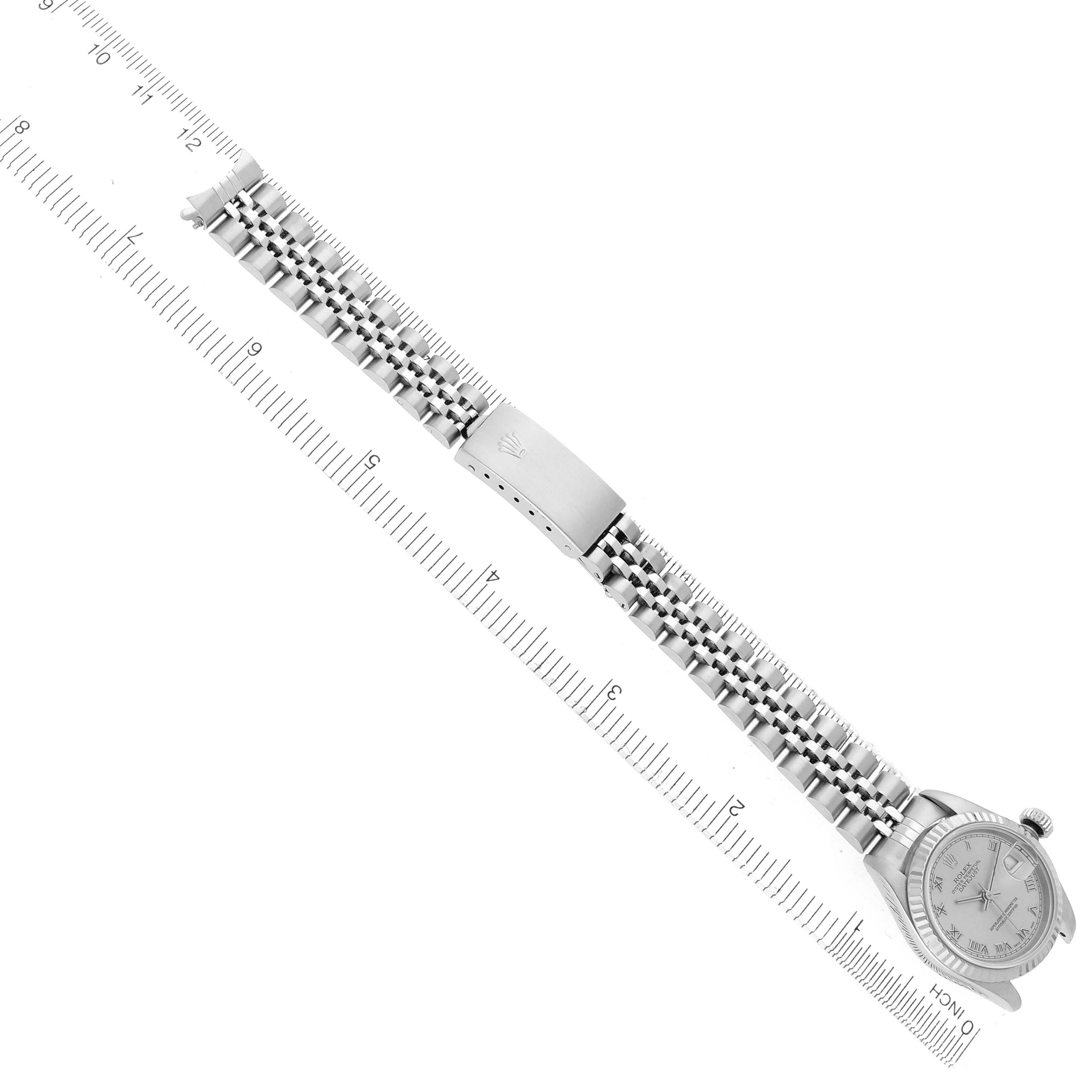 The Rolex Datejust 79174 Women
s Stainless Steel Silver Dial 79174 Women
s Stainless Steel Silver Dial watch is shown from a top view, highlighting the bracelet, clasp, and part of the dial.