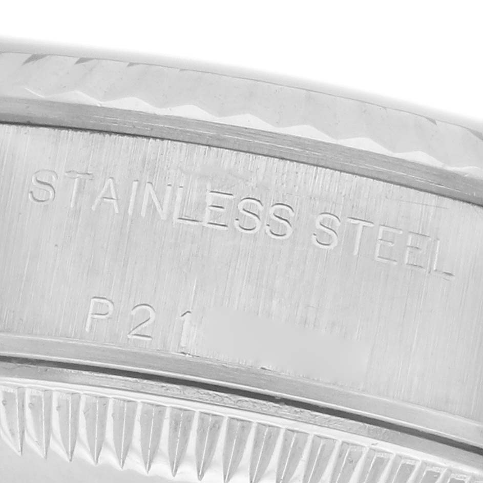 The image shows a close-up of the case side of a Rolex Datejust 79174 Women
s Stainless Steel Silver Dial 79174 Women
s Stainless Steel Silver Dial, highlighting the stainless steel engraving.