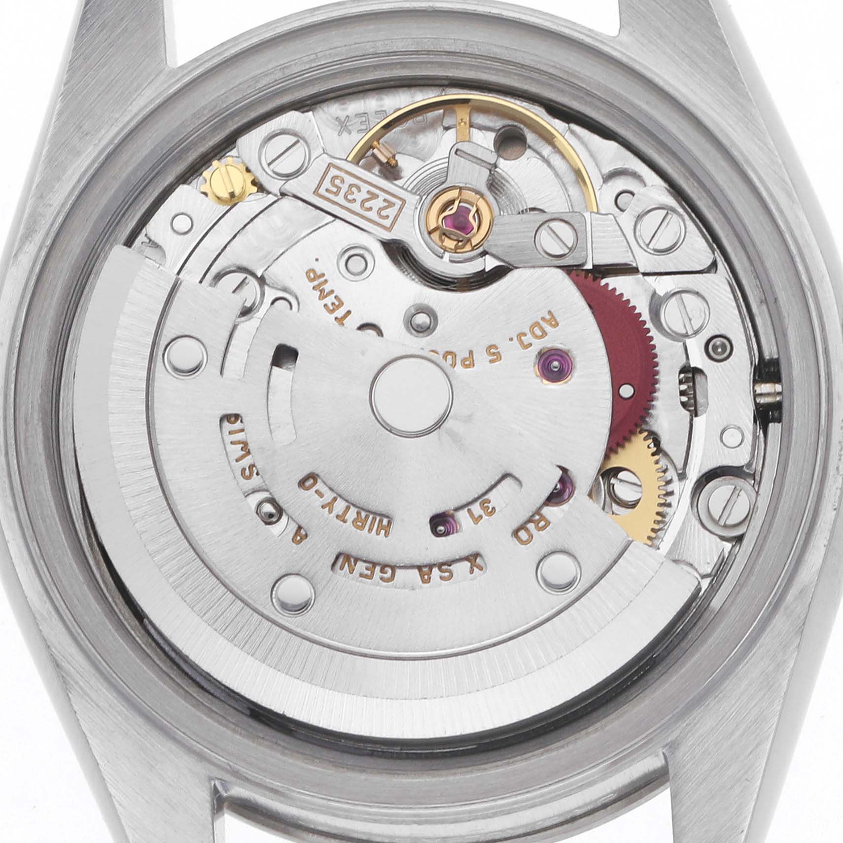 The image shows a close-up of the Rolex Datejust 79174 Women
s Stainless Steel Silver Dial 79174 Women
s Stainless Steel Silver Dial
s movement from the back, highlighting gears and the rotor.