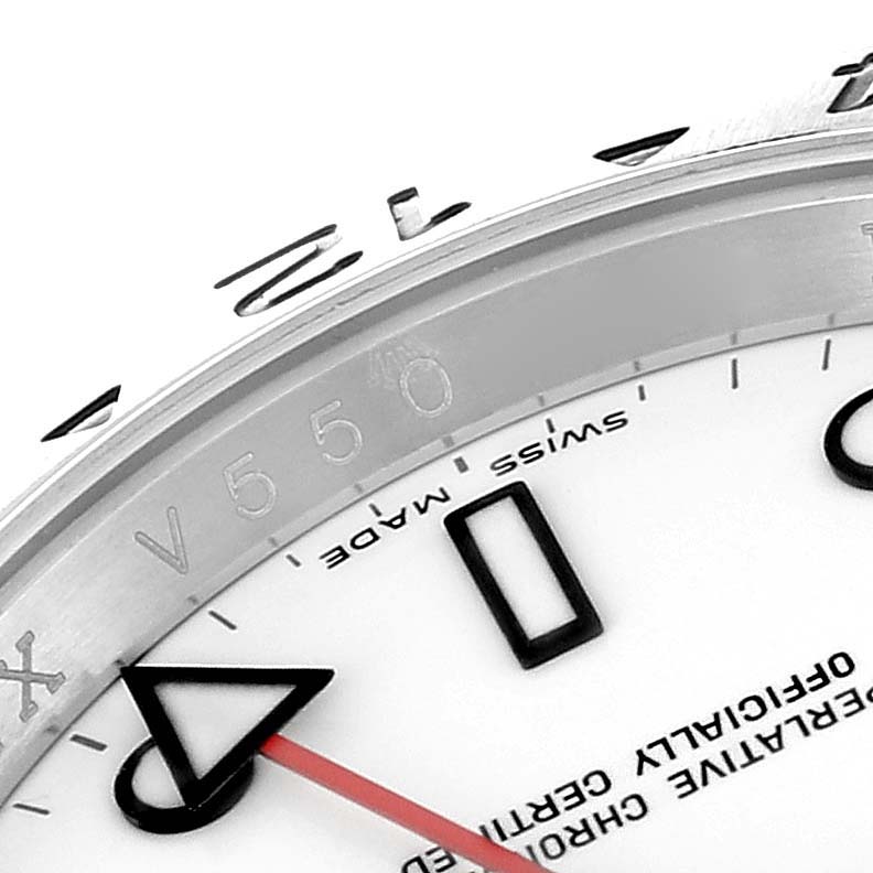Close-up of the Rolex Explorer 16570 Men
s Stainless Steel White Dial 16570 Men
s Stainless Steel White Dial watch, showing part of the dial, bezel, and the triangle marker with red arrow hand.