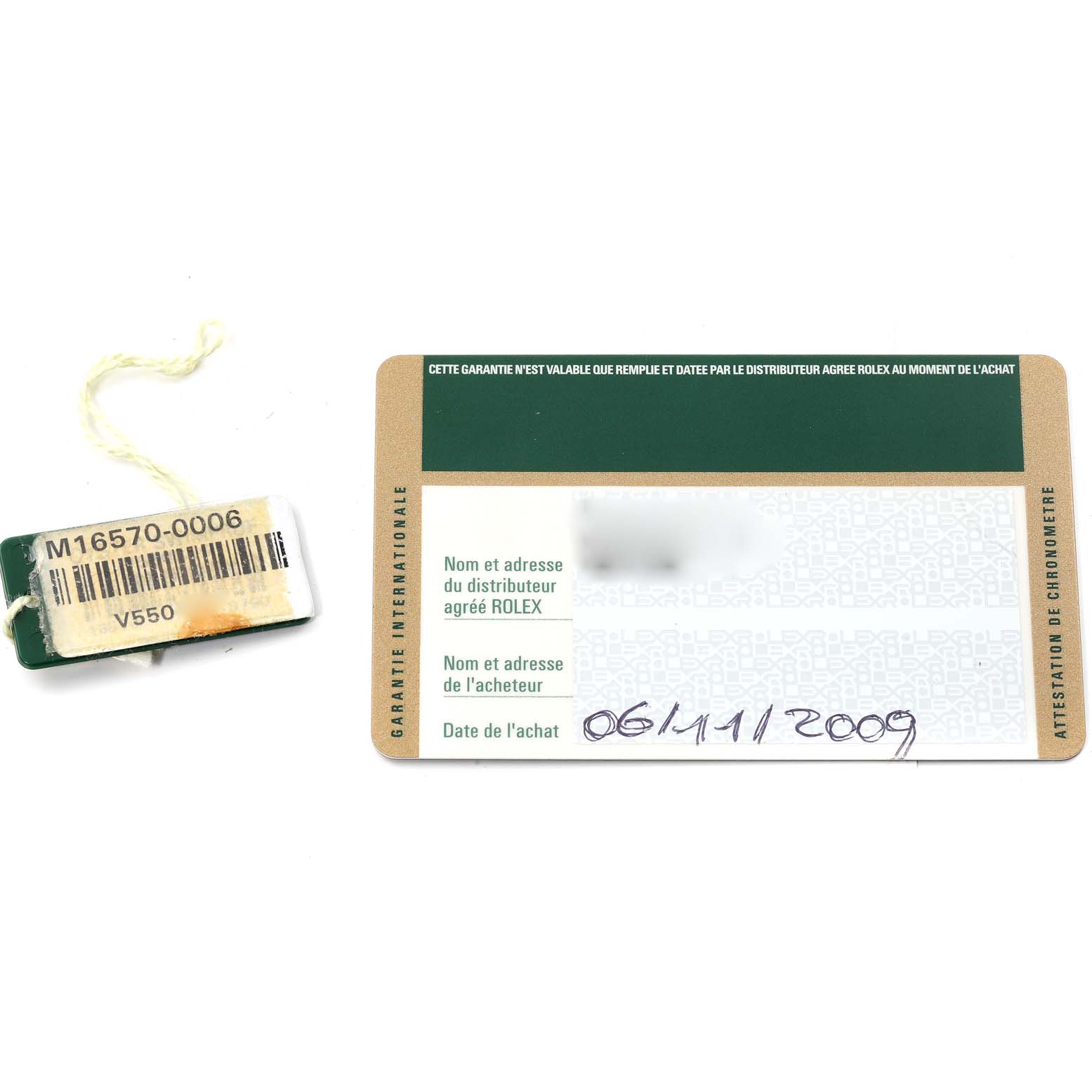 The image shows a Rolex Explorer 16570 Men
s Stainless Steel White Dial 16570 Men
s Stainless Steel White Dial model warranty card and a hang tag with the model number.