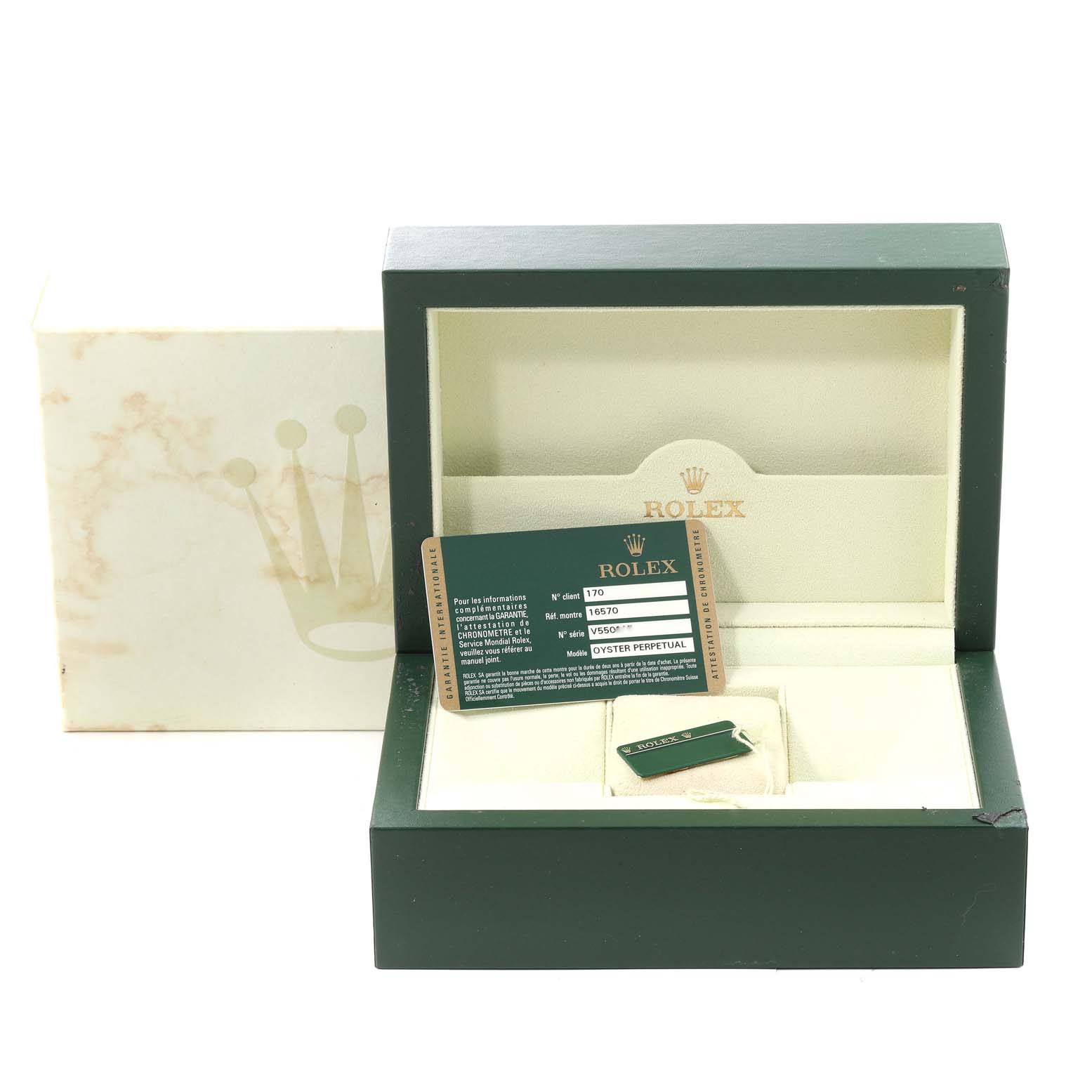 This image shows the packaging, warranty card, and tags for a Rolex Explorer 16570 Men
s Stainless Steel White Dial 16570 Men
s Stainless Steel White Dial watch.