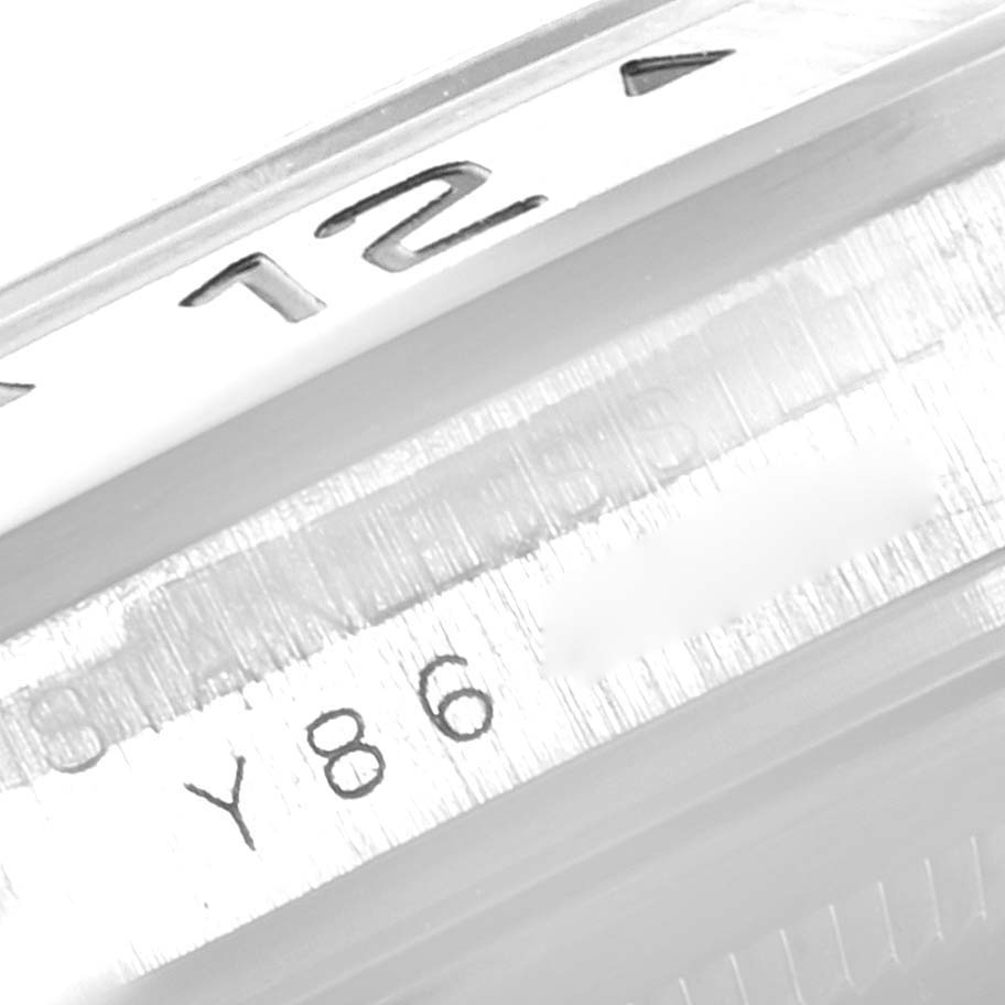 The image shows a close-up of the serial number and the bezel edge of a Rolex Explorer 16570 Men
s Stainless Steel White Dial 16570 Men
s Stainless Steel White Dial watch.