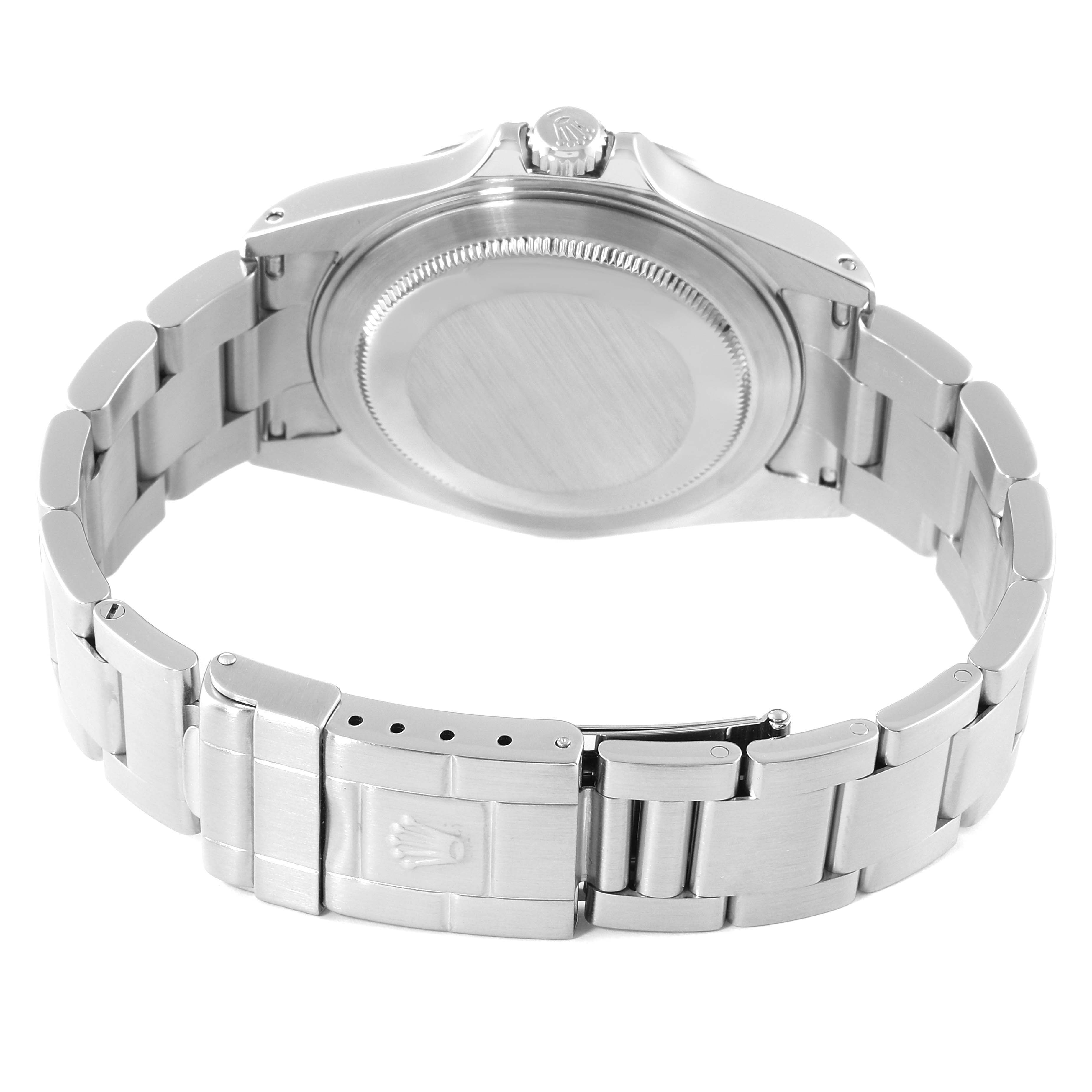 The image shows the back view of a Rolex Explorer 16570 Men
s Stainless Steel Black Dial 16570 Men
s Stainless Steel Black Dial watch, highlighting its stainless steel caseback and bracelet with clasp.