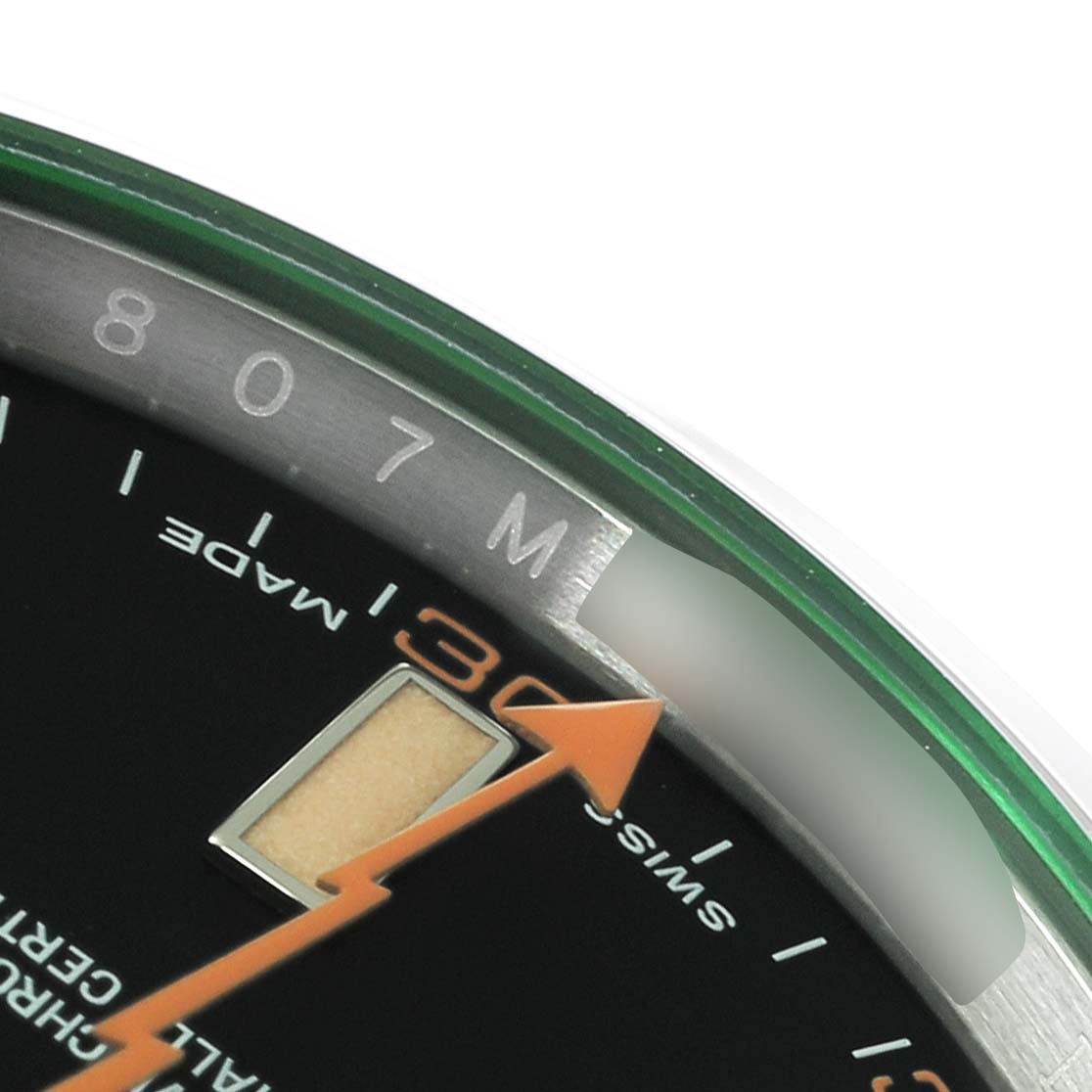 This image shows a close-up of the dial of a Rolex Milgauss 116400GV Men's Stainless Steel Black Dial 116400GV Men's Stainless Steel Black Dial watch, focusing on the orange seconds hand, indices, and part of the outer rim.
