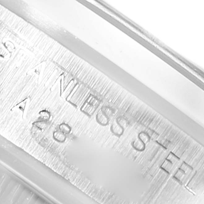 This image shows a close-up of the case back or inner rim of a Rolex Oyster Perpetual 76080 Women
s Stainless Steel Blue Dial 76080 Women
s Stainless Steel Blue Dial, highlighting the "STAINLESS STEEL" engraving.