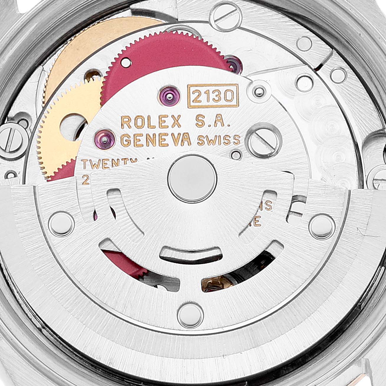 The image shows a close-up view of the movement of a Rolex Oyster Perpetual 67193 Women
s Steel and Gold (two tone) Black Dial 67193 Women
s Steel and Gold (two tone) Black Dial watch, highlighting the intricate gears and markings.