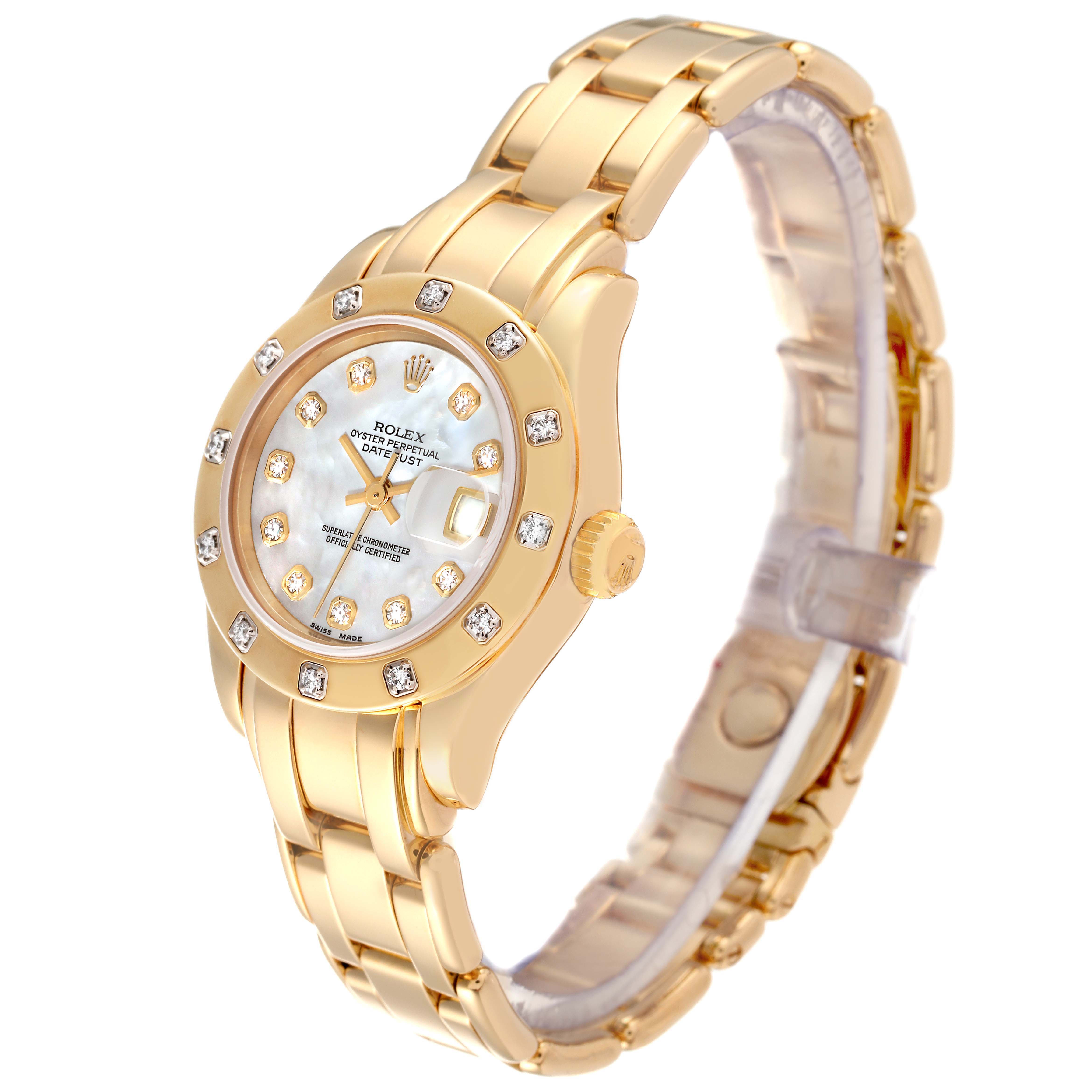 The Rolex Pearlmaster 69318 Women
s Yellow Gold Mother of Pearl Dial 69318 Women
s Yellow Gold Mother of Pearl Dial watch is shown at a three-quarter angle, highlighting its gold case, diamond bezel, bracelet, and mother-of-pearl dial.
