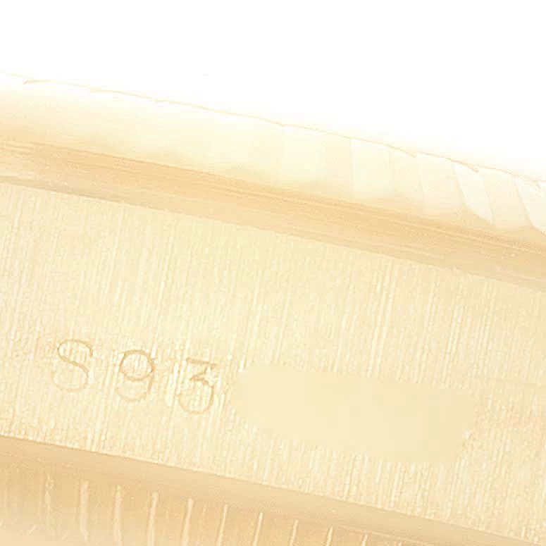 This is a close-up of the case side, showing the fluted bezel and partially visible engravings on the Rolex President 68278 Women
s Yellow Gold Champagne Dial 68278 Women
s Yellow Gold Champagne Dial model watch.