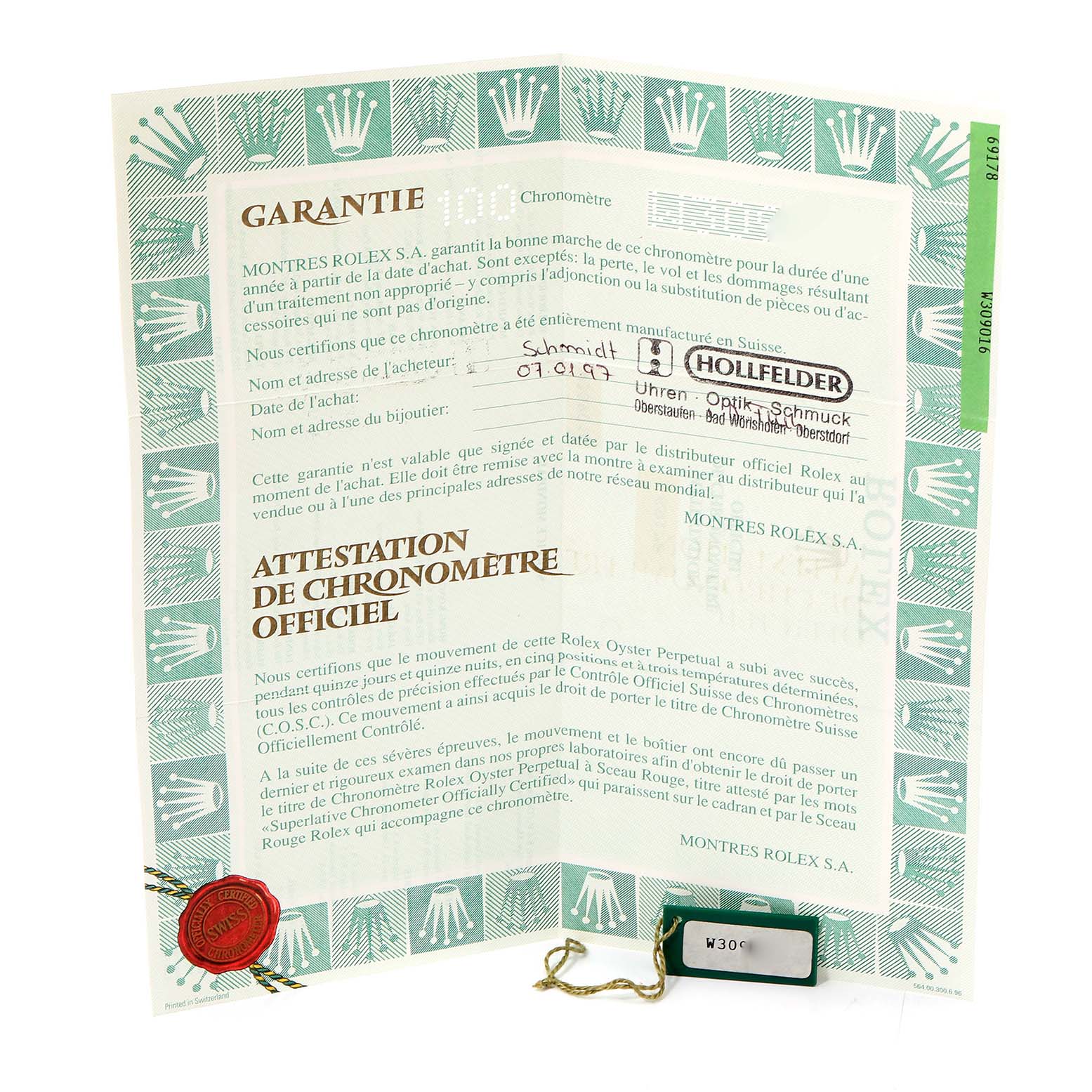 This image shows the warranty and certification papers for a Rolex President 69178 Women
s Yellow Gold Mother of Pearl Dial 69178 Women
s Yellow Gold Mother of Pearl Dial model, along with a green tag.