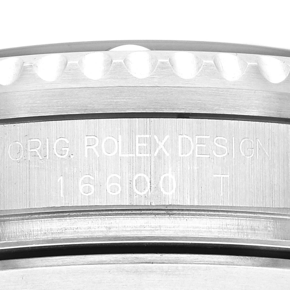 This close-up image shows the side of a Rolex Sea-Dweller 16600 Men's Stainless Steel Black Dial 16600 Men's Stainless Steel Black Dial watch, featuring the engraved model number and "Orig. Rolex Design" text.