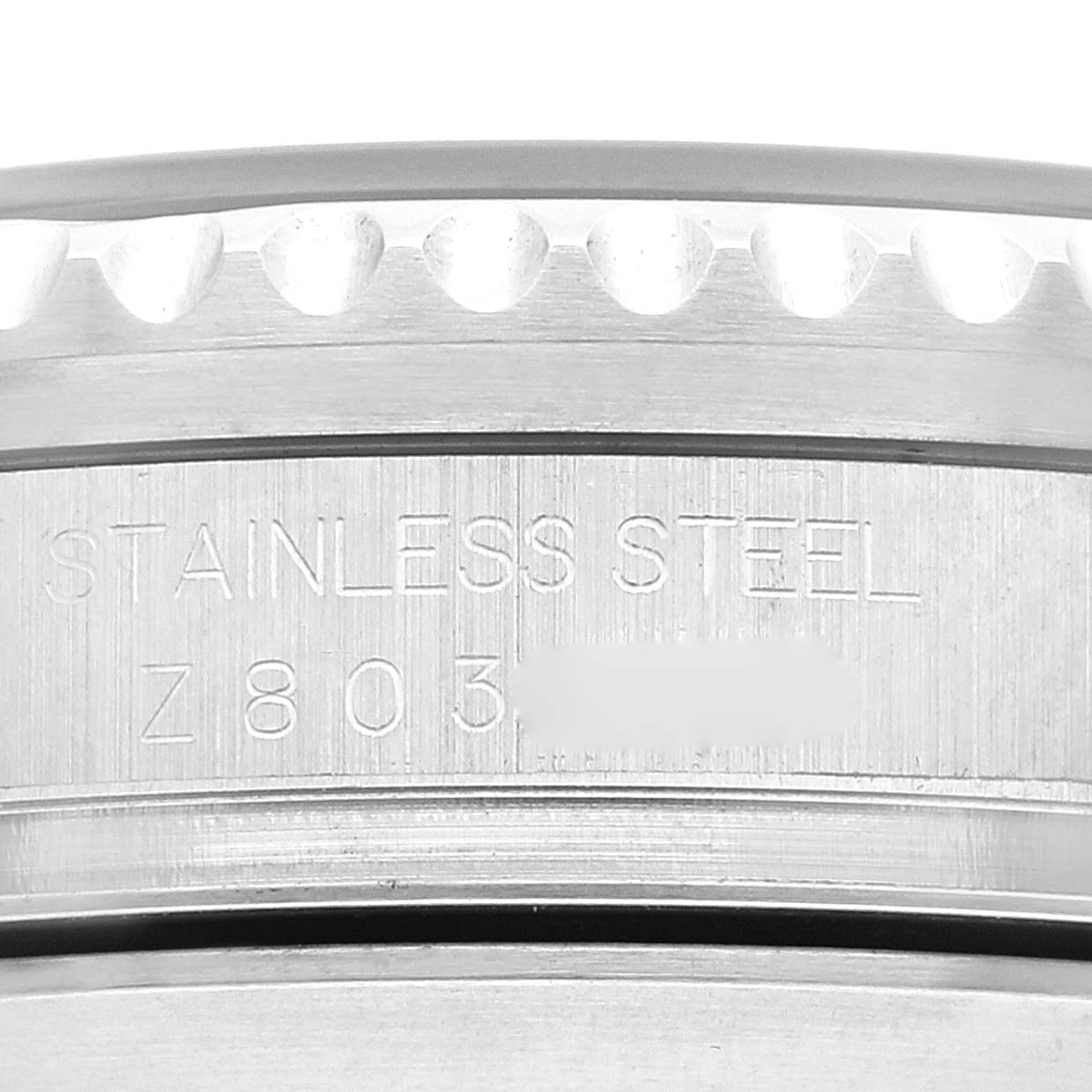 This close-up image shows the stainless steel case back and part of the bezel of the Rolex Sea-Dweller 16600 Men's Stainless Steel Black Dial 16600 Men's Stainless Steel Black Dial model.