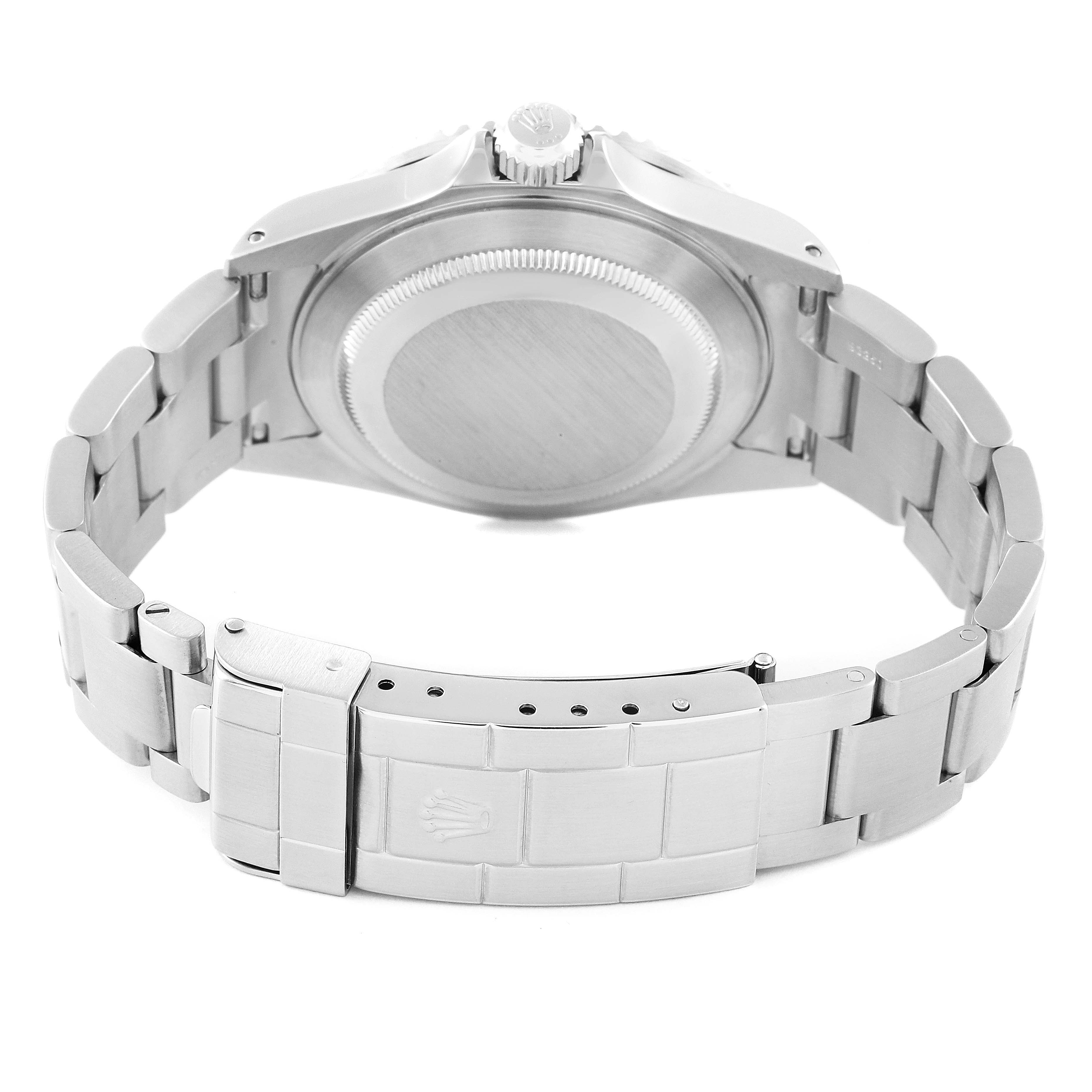 The image shows the Rolex Submariner 16610 Men
s Stainless Steel Black Dial 16610 Men
s Stainless Steel Black Dial from the back, highlighting the bracelet, clasp, and the case back.