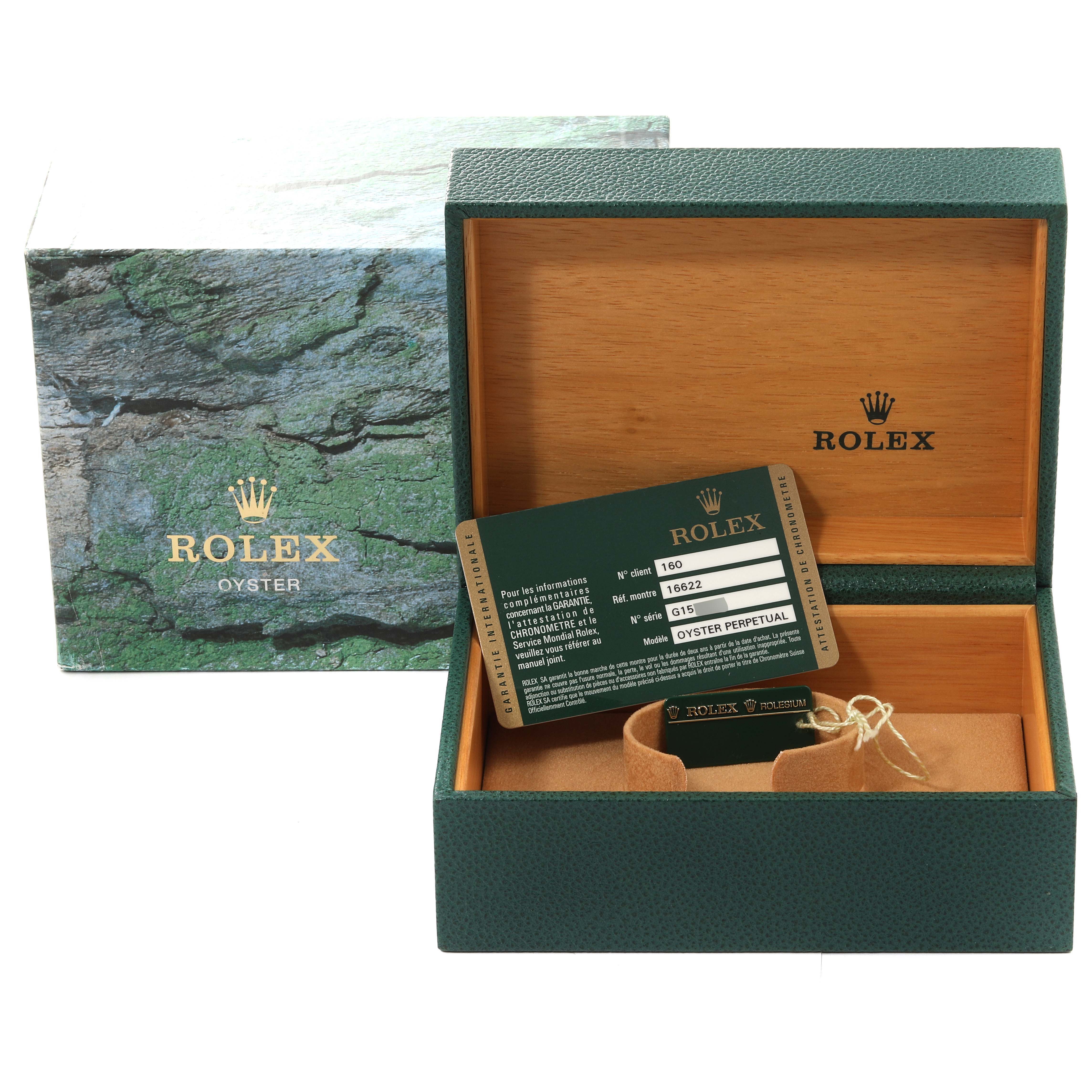 The image shows the open box and warranty card of a Rolex Yacht-Master 16622 Men's Stainless Steel Silver Dial 16622 Men's Stainless Steel Silver Dial watch, with the outer green box in the background.