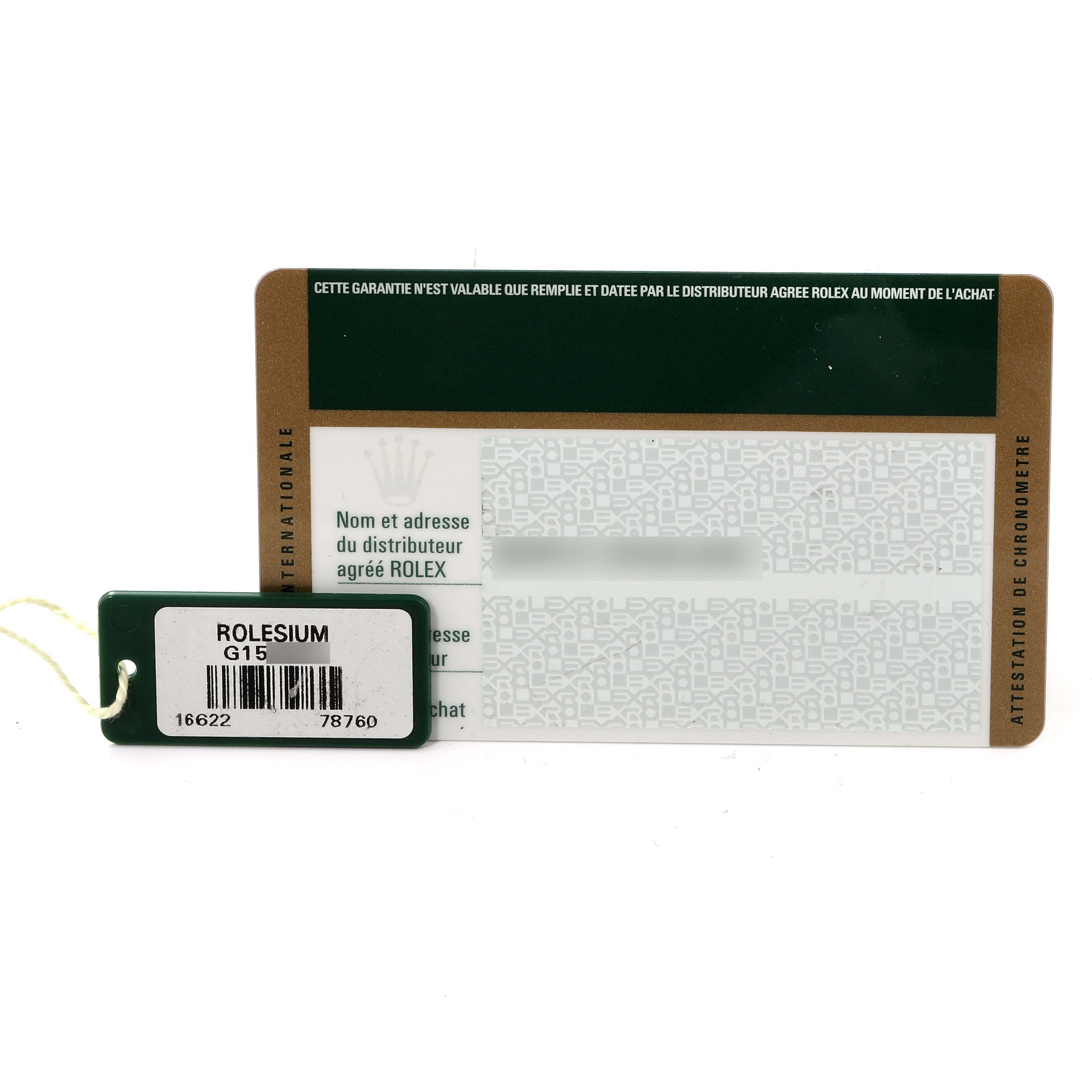 This image shows the warranty card and tag for a Rolex Yacht-Master 16622 Men's Stainless Steel Silver Dial 16622 Men's Stainless Steel Silver Dial, including model and serial numbers.