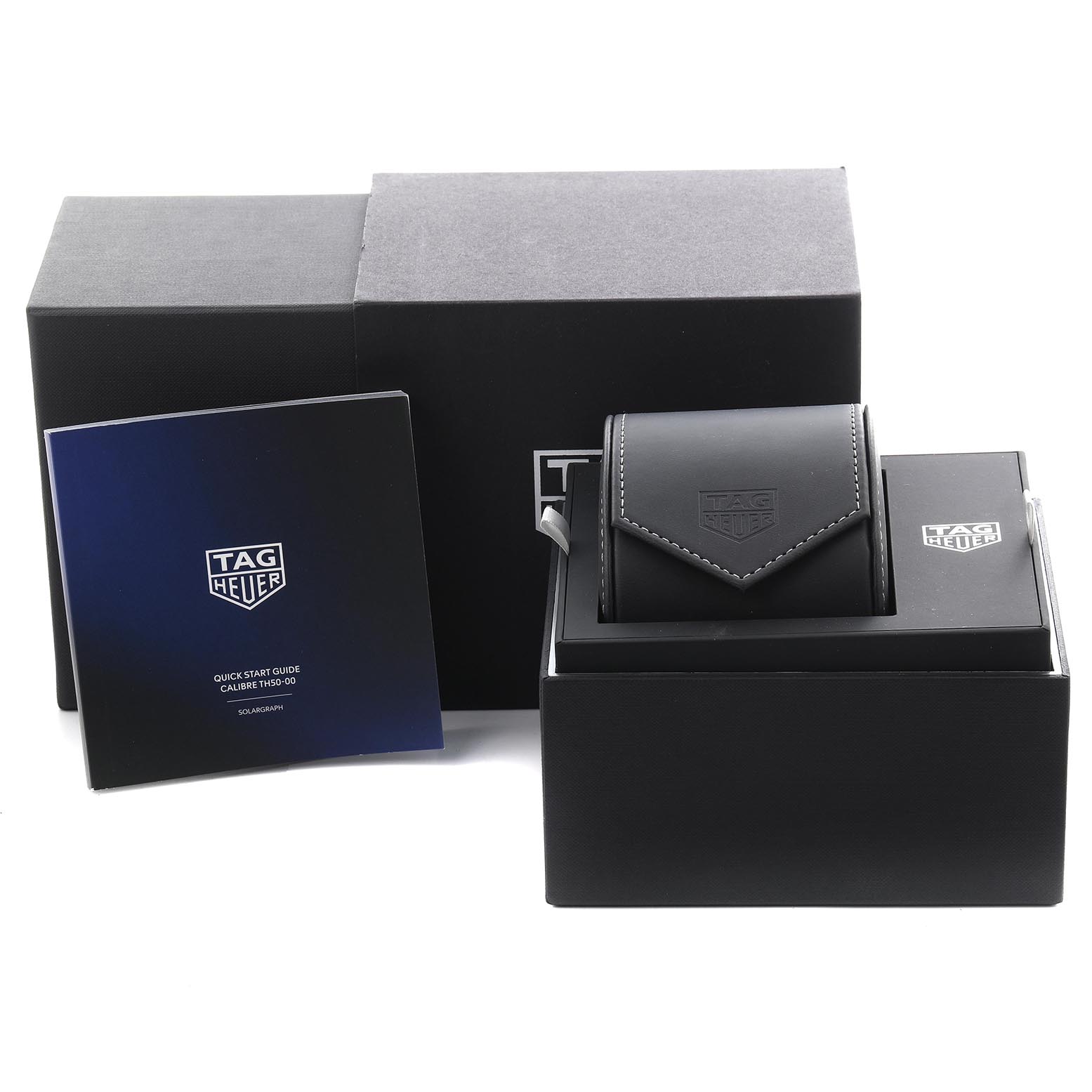 The image shows the Tag Heuer Aquaracer WBP1112.FT6199 Men
s Stainless Steel Black Dial WBP1112.FT6199 Men
s Stainless Steel Black Dial packaging, including a box, case, and instruction manual.