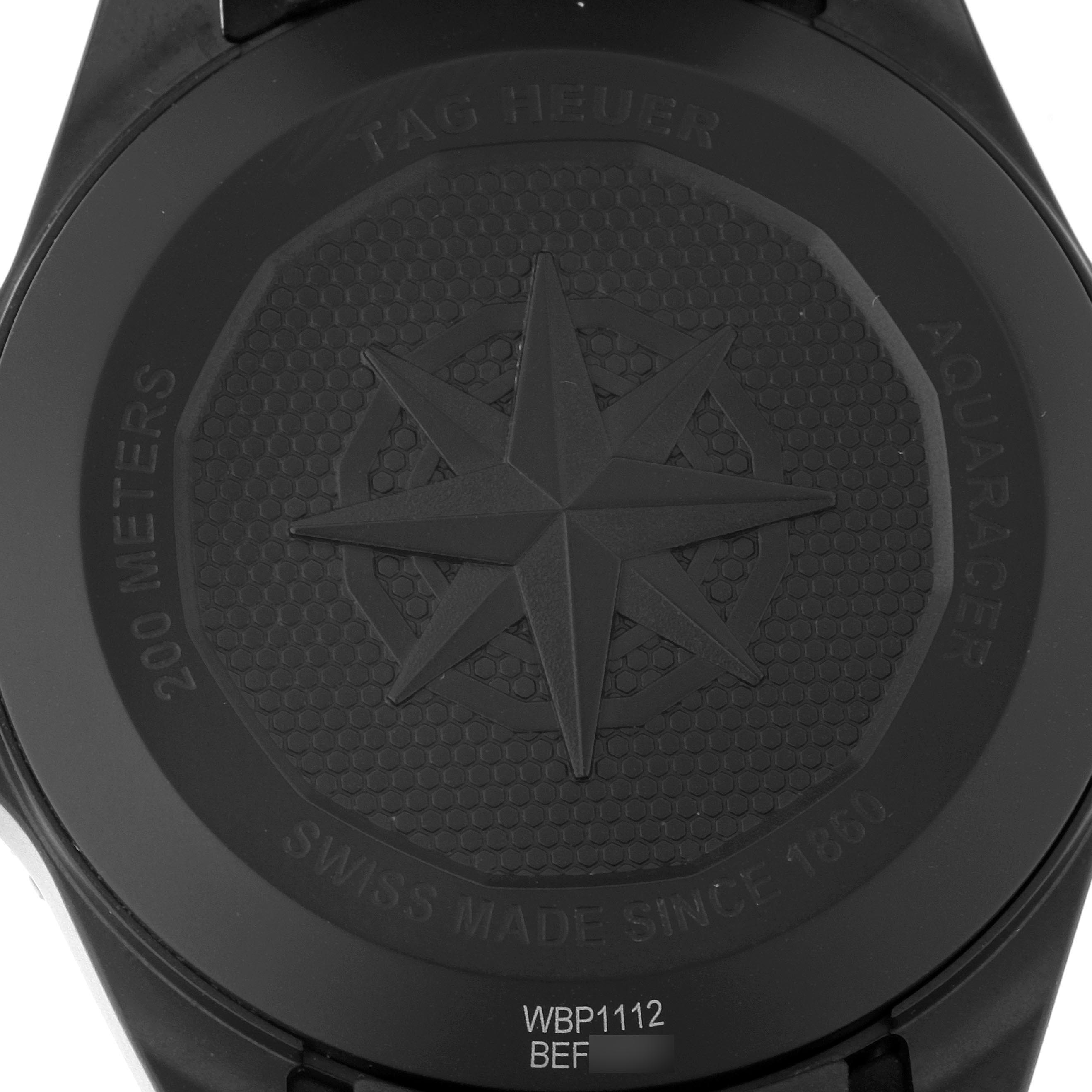 This image shows the back case of the Tag Heuer Aquaracer WBP1112.FT6199 Men
s Stainless Steel Black Dial WBP1112.FT6199 Men
s Stainless Steel Black Dial watch, highlighting the engraved design and model details.