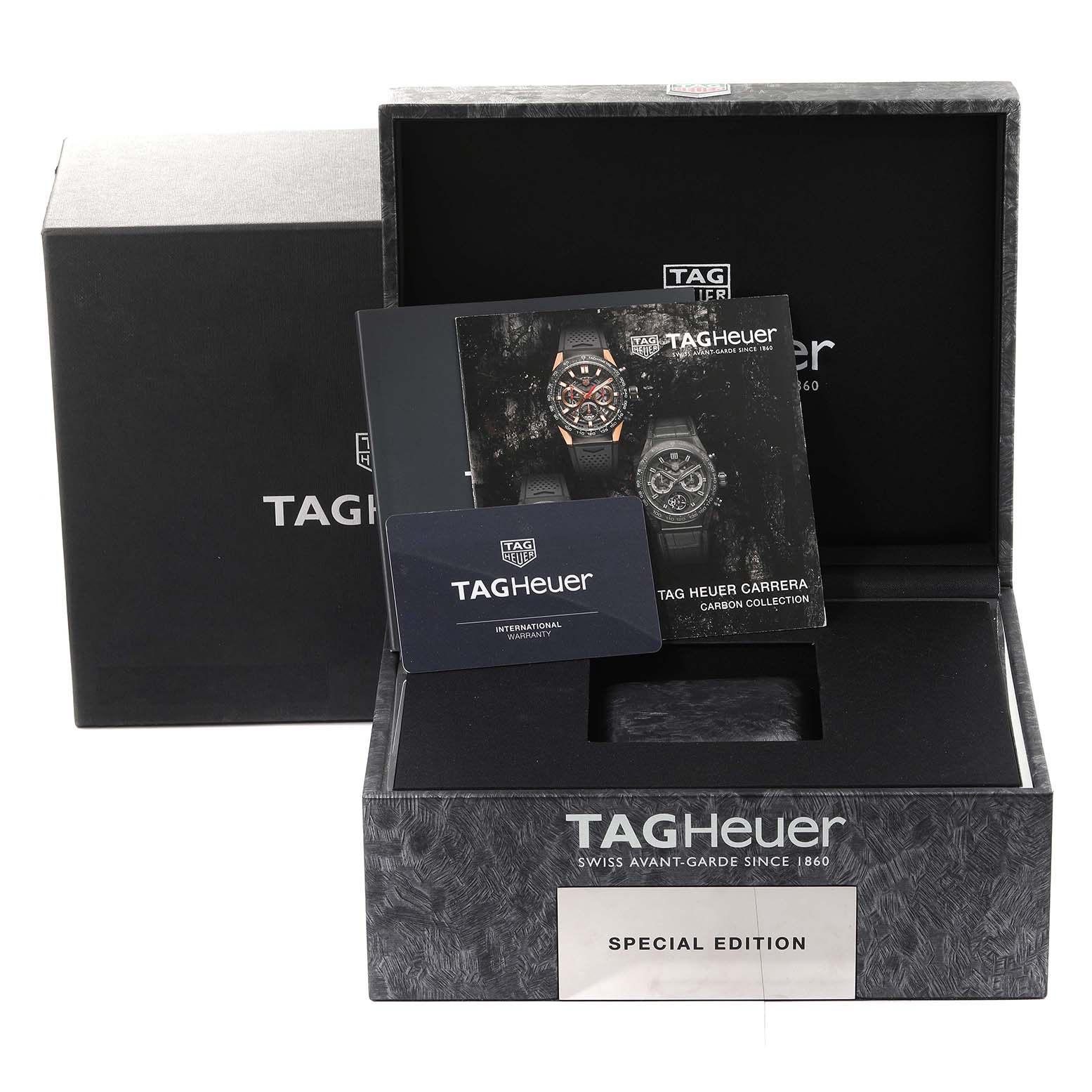 The image shows the packaging, warranty card, and booklet for the Limited Edition Tag Heuer Carrera watch.