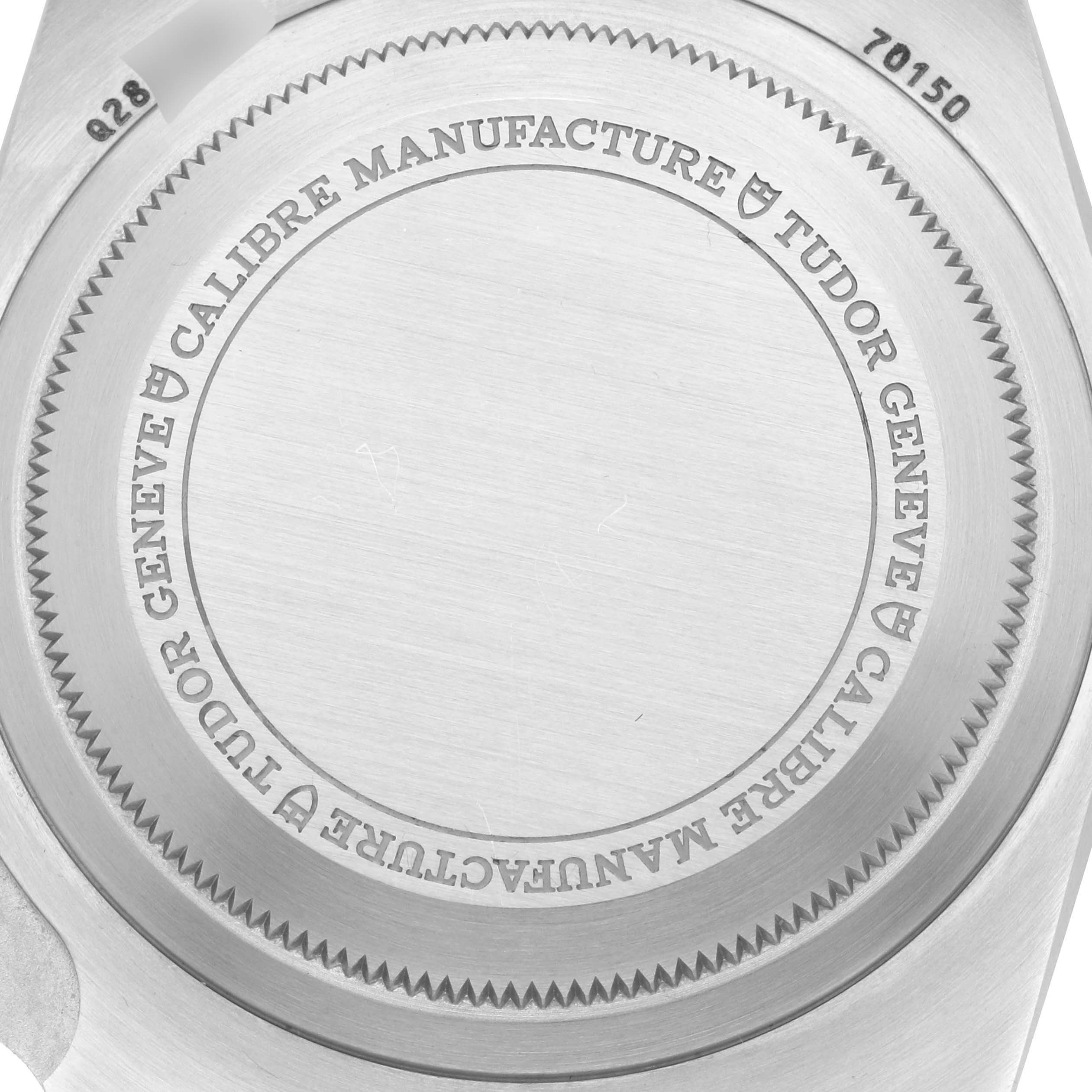 The image shows the case back of the Tudor Heritage Black Bay 70150 Men's Stainless Steel Black Dial 70150 Men's Stainless Steel Black Dial watch, highlighting its engraved markings.