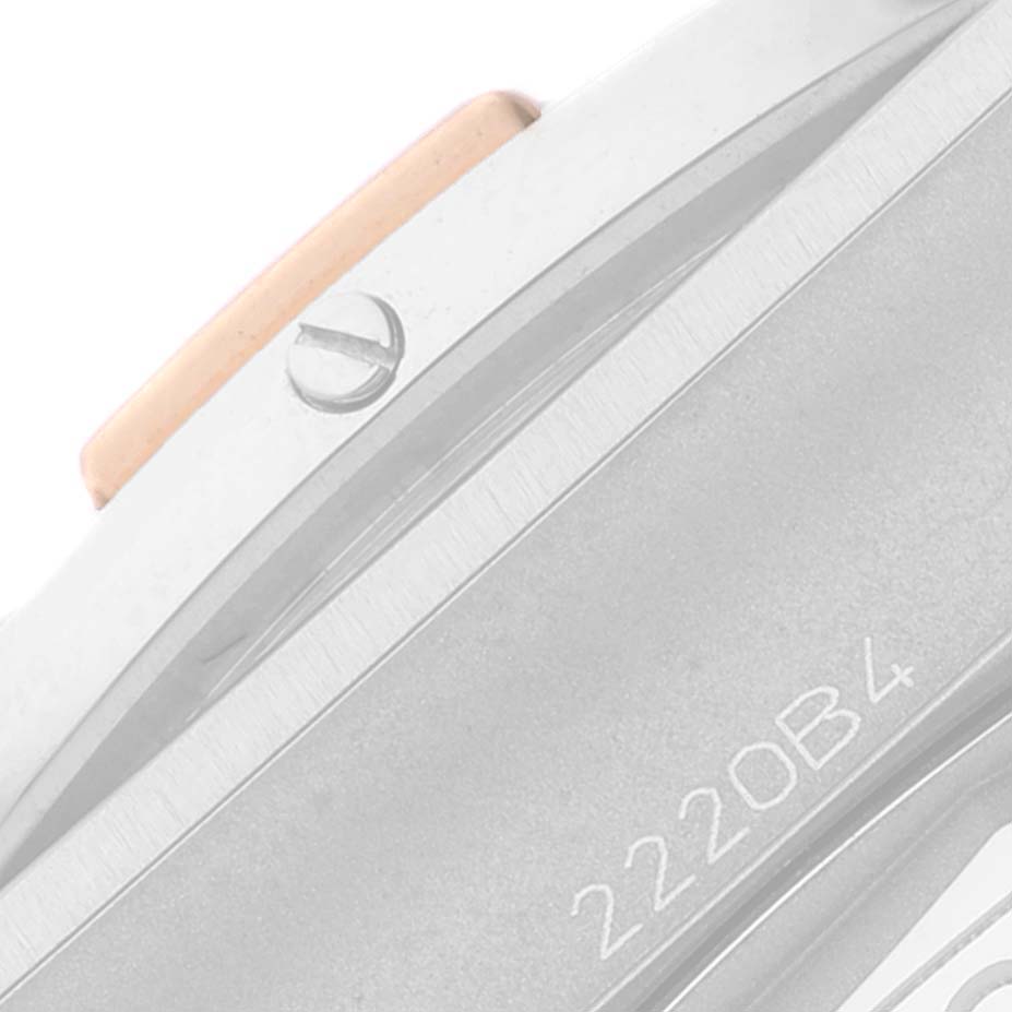 This close-up image shows a partial side view of the Breitling Chronomat IB0134 Men's Steel and Gold (two tone) Silver Dial IB0134 Men's Steel and Gold (two tone) Silver Dial model, highlighting the crown and casing.