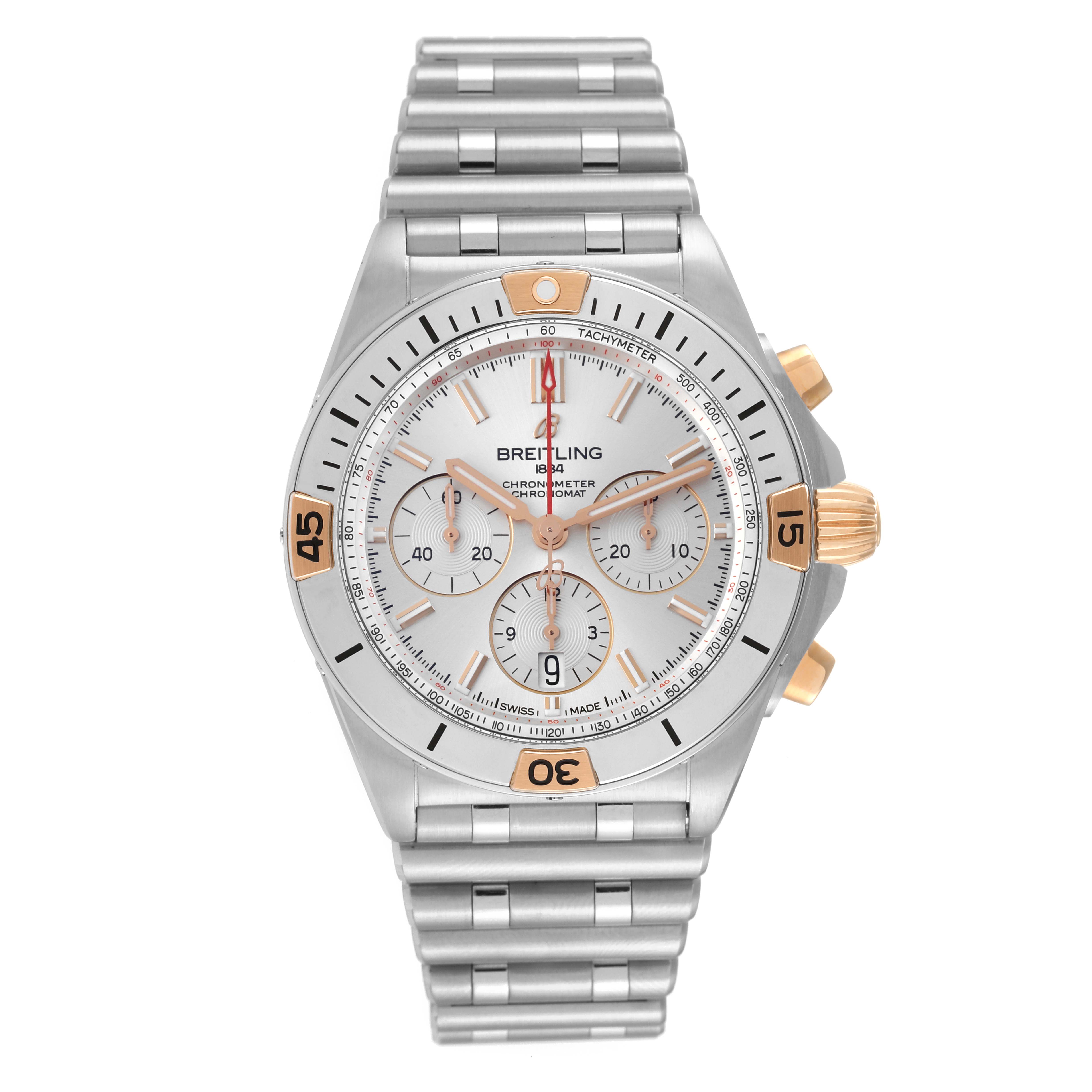 The Breitling Chronomat IB0134 Men's Steel and Gold (two tone) Silver Dial IB0134 Men's Steel and Gold (two tone) Silver Dial watch is shown from a top-down angle, displaying its face, bezel, and metal bracelet.