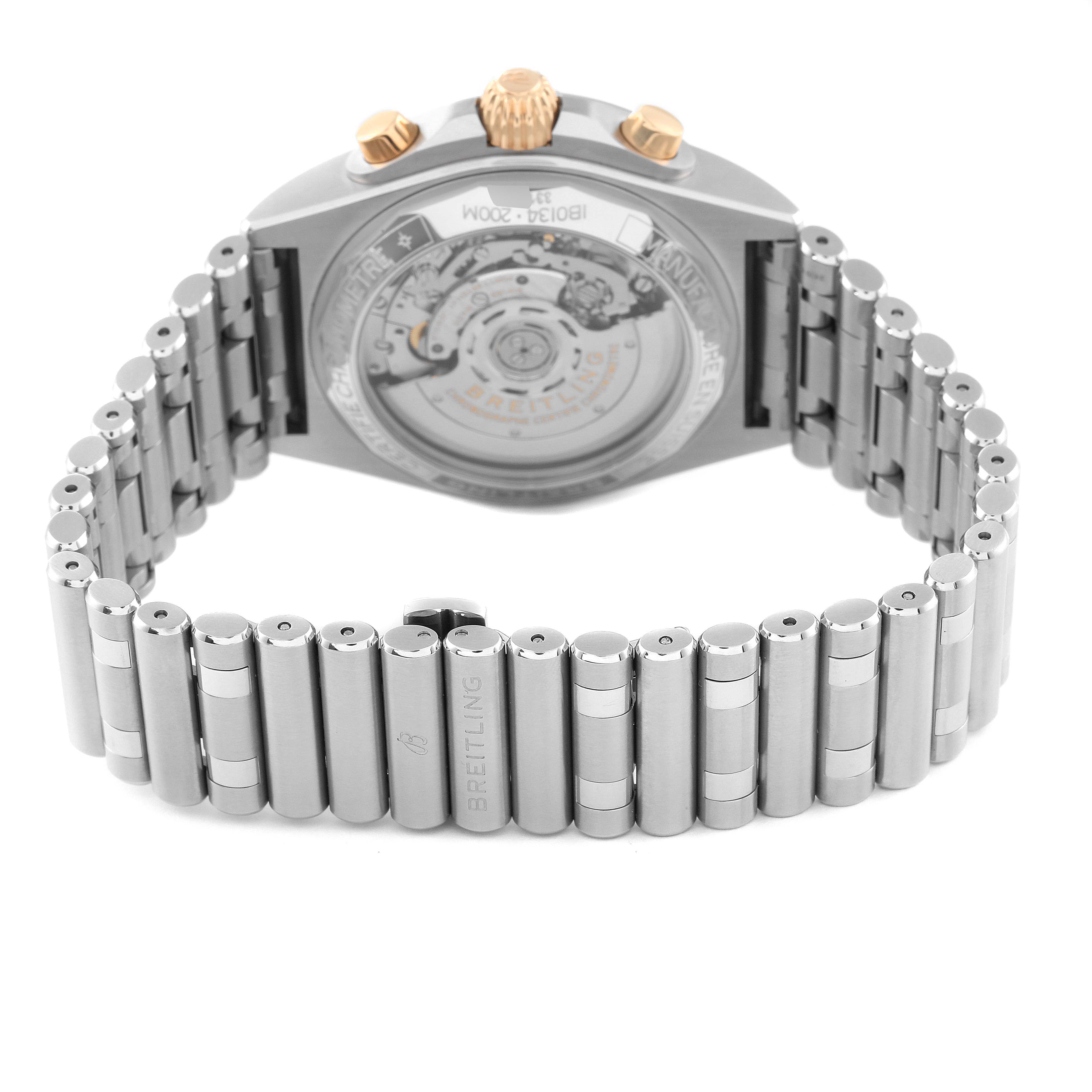 This image shows the back and bracelet of the Breitling Chronomat IB0134 Men's Steel and Gold (two tone) Silver Dial IB0134 Men's Steel and Gold (two tone) Silver Dial watch, highlighting its movement and metal links.
