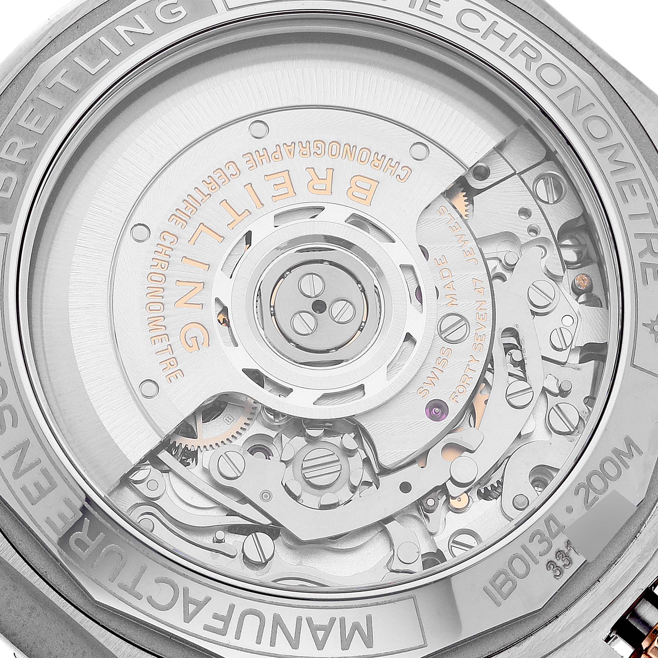 This image shows the underside of a Breitling Chronomat IB0134 Men's Steel and Gold (two tone) Silver Dial IB0134 Men's Steel and Gold (two tone) Silver Dial watch, highlighting its intricate movement mechanism.