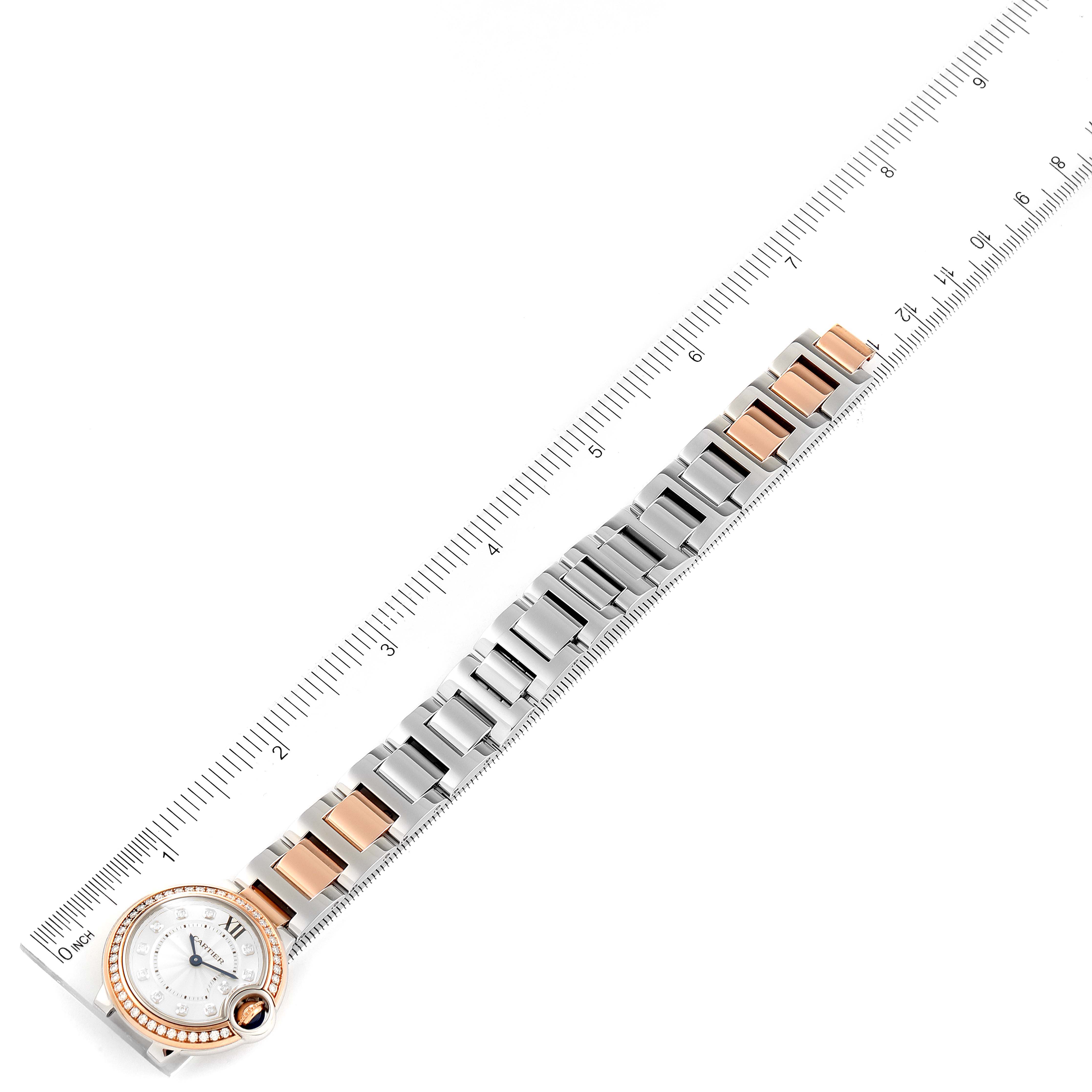 The image shows a top-down view of a Cartier Ballon Bleu W3BB0009 Women's Steel and Gold (two tone) Silver Dial W3BB0009 Women's Steel and Gold (two tone) Silver Dial watch, highlighting the bracelet with a ruler for scale.