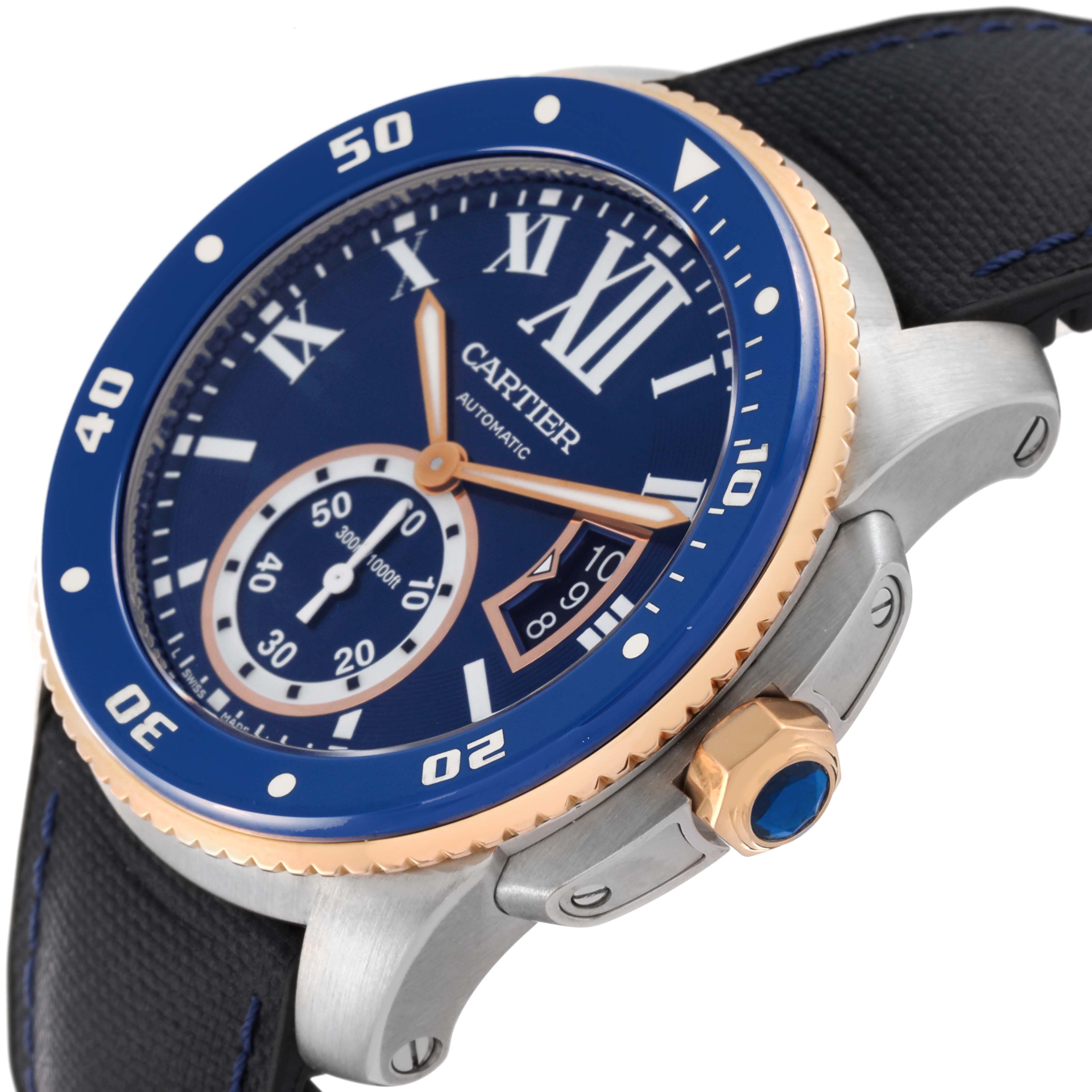 The image shows a Calibre de Cartier watch by Cartier at an angled close-up, highlighting the face, bezel, crown, and part of the strap.