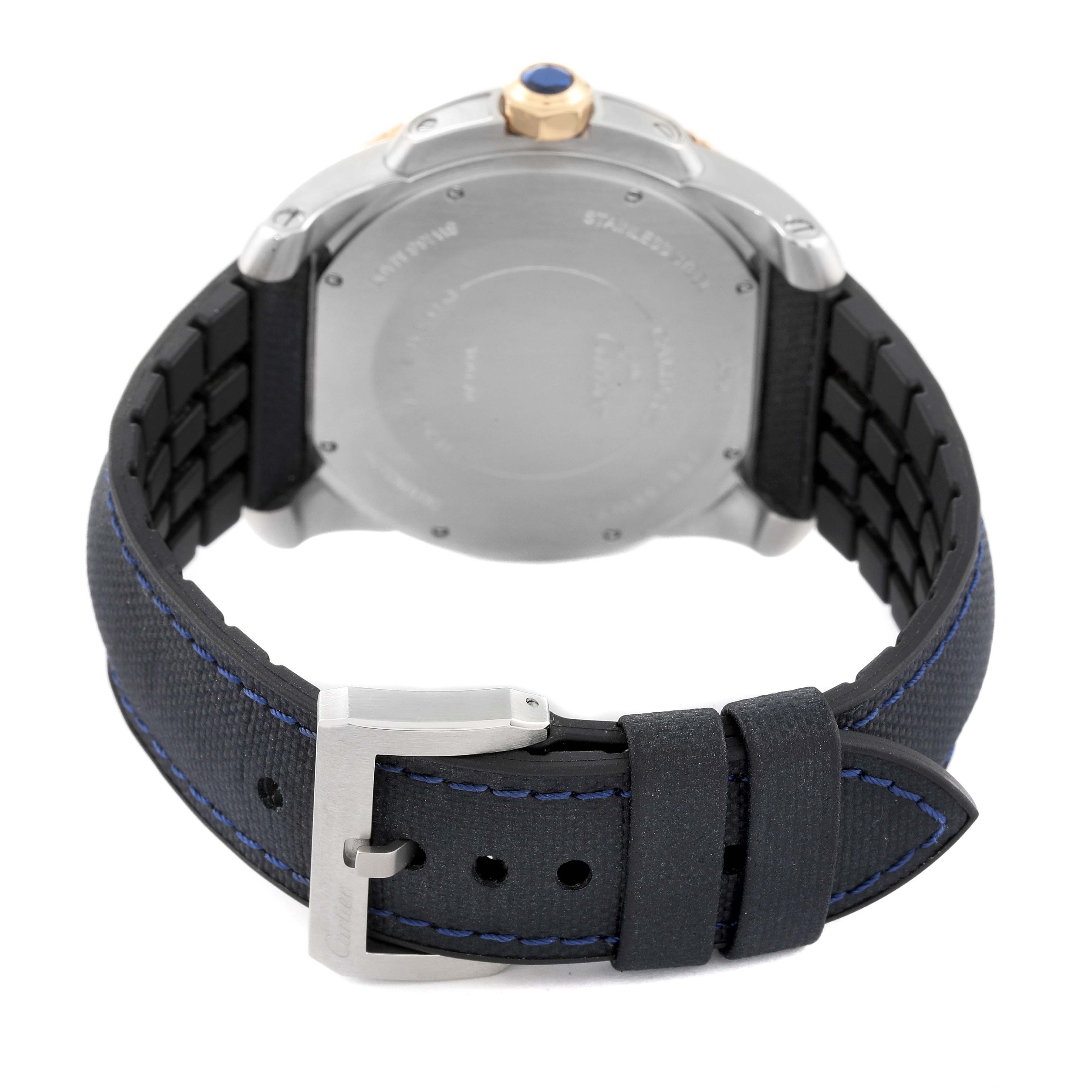 This image shows the back angle of the Calibre de Cartier watch by Cartier, featuring its case back, buckle, and strap.