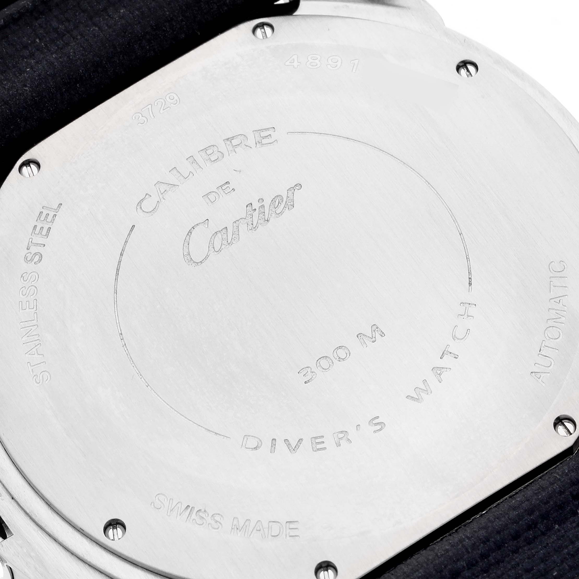 This image shows the back case of the Calibre de Cartier watch by Cartier, showcasing its engravings.