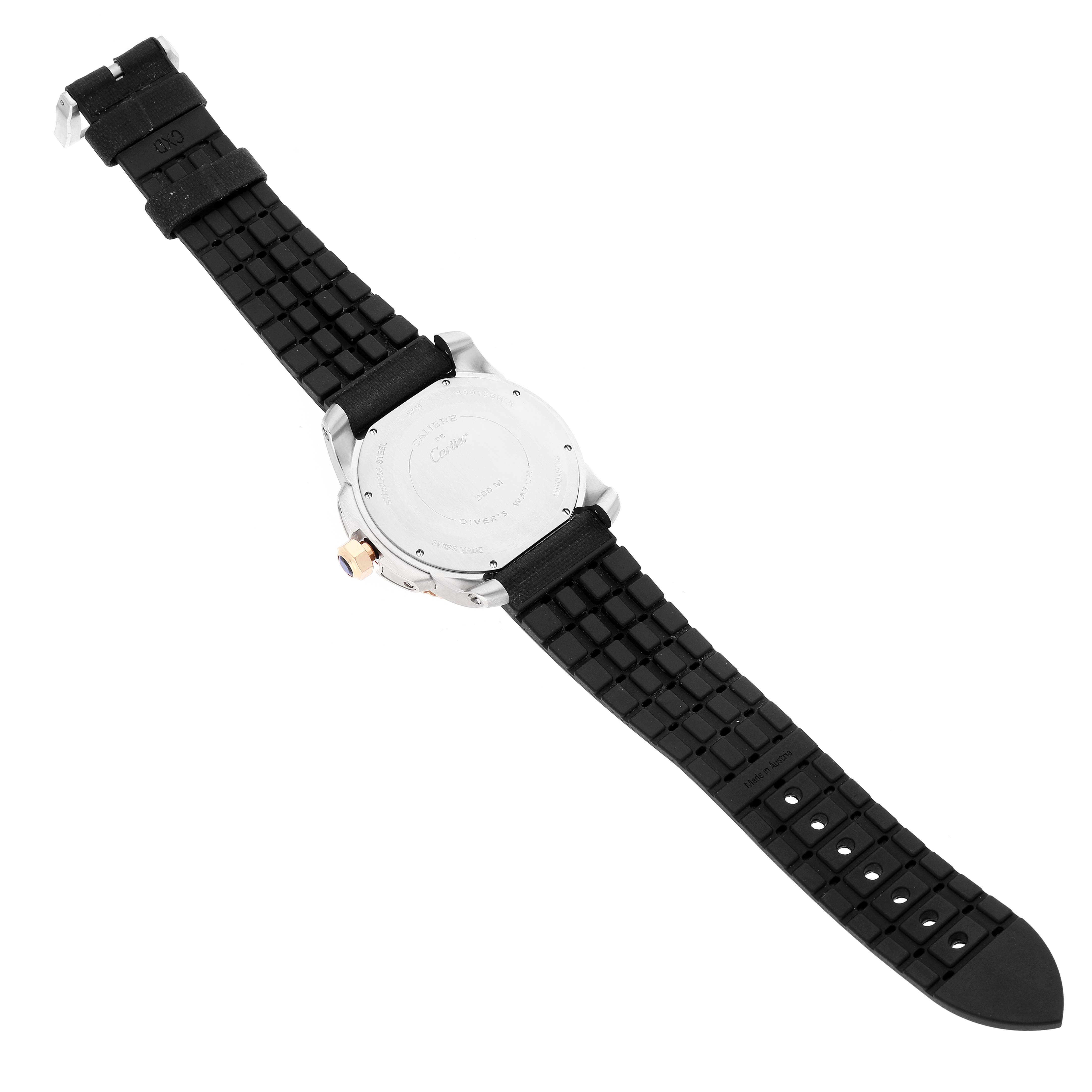 The image shows the back view of a Calibre de Cartier watch by Cartier, featuring its case back and black strap.