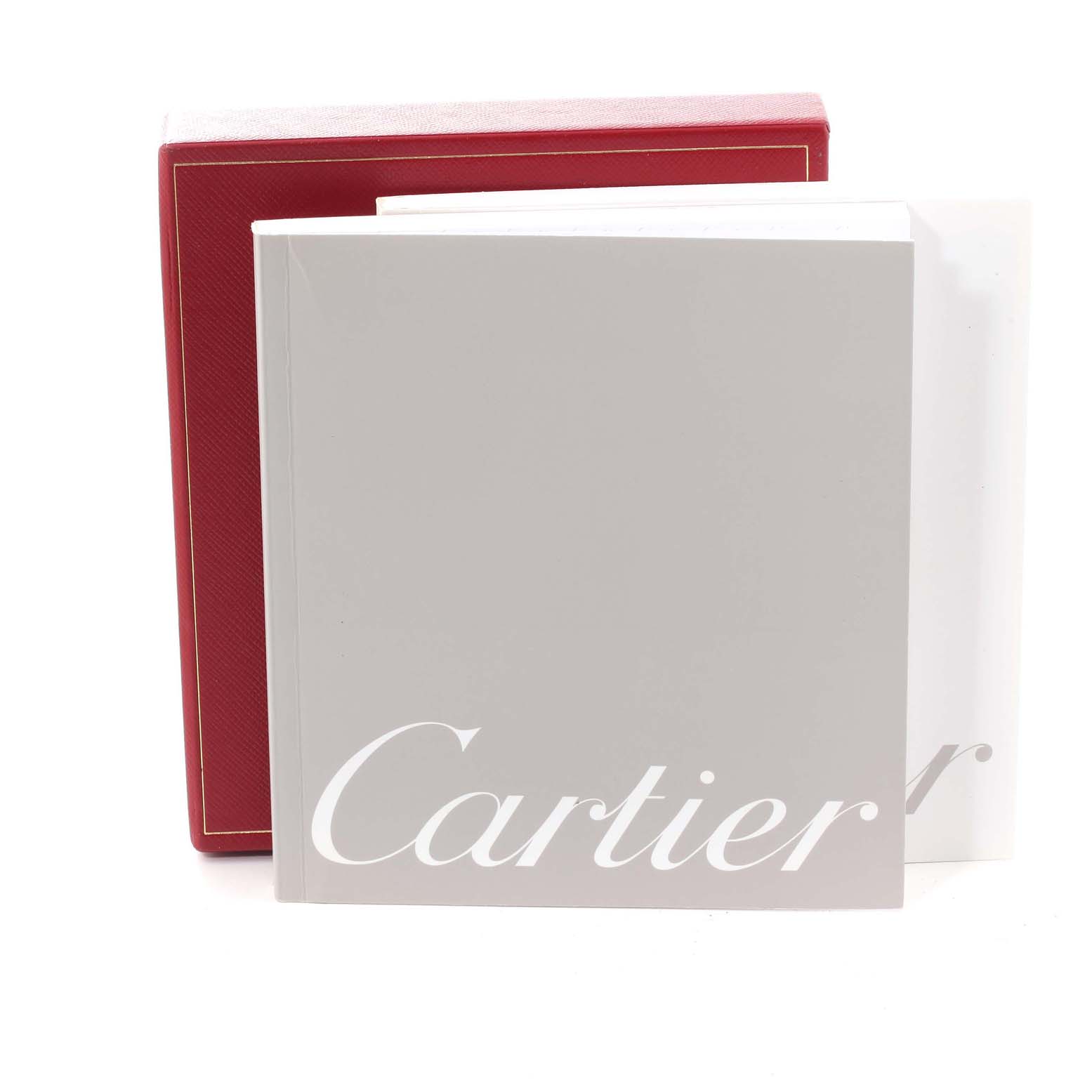 This image shows the packaging and manual for a Cartier Roadster W62020X6 Men's Stainless Steel Black Dial W62020X6 Men's Stainless Steel Black Dial watch, including a red box and a booklet with "Cartier" written on it.