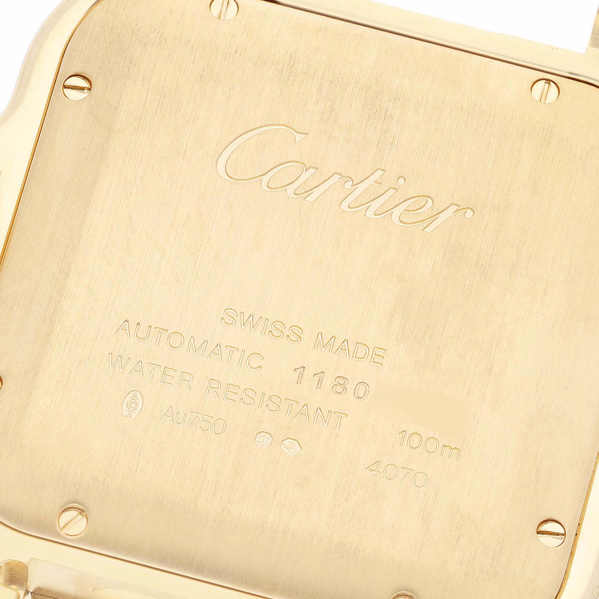 This image shows the case back of the Santos model by Cartier, highlighting its engravings and screws.