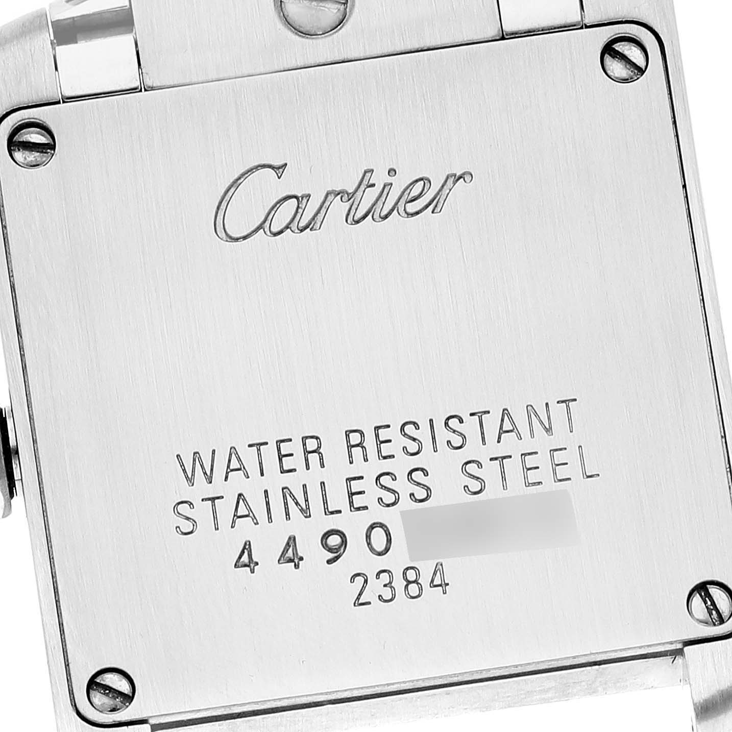 The image shows the stainless steel back cover of a Cartier Tank Francaise W51026Q3 Women's Stainless Steel Black Dial W51026Q3 Women's Stainless Steel Black Dial watch, highlighting its water resistance.