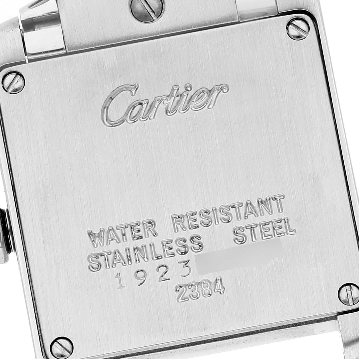 The image shows the back case of a Cartier Tank Francaise W51008Q3 Women's Stainless Steel Silver Dial W51008Q3 Women's Stainless Steel Silver Dial watch, highlighting the brand name and material specifications.