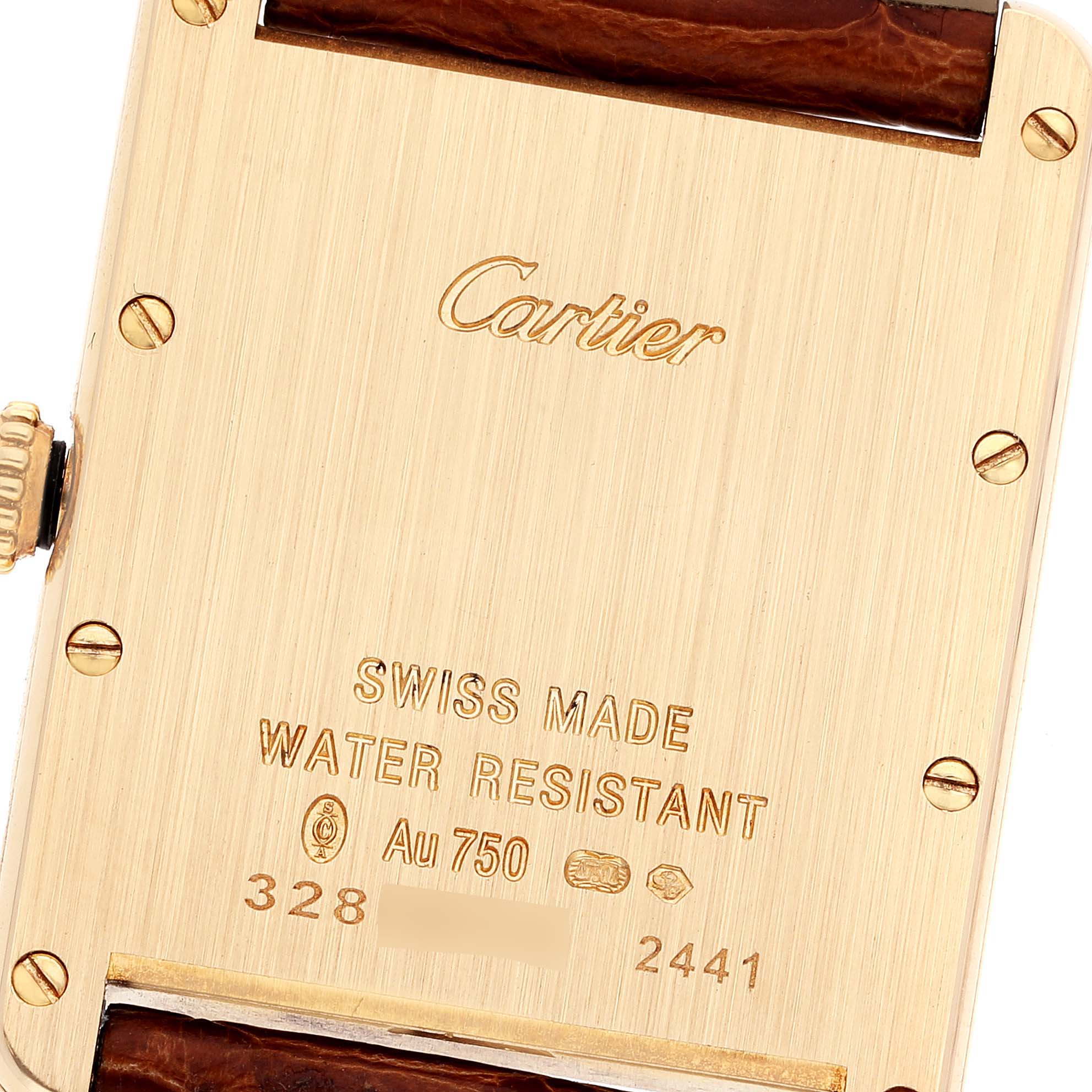 This image shows the back case of a Cartier Tank Louis W1529756 Men's Yellow Gold Silver Dial W1529756 Men's Yellow Gold Silver Dial watch, detailing its engravings and part of the leather strap.