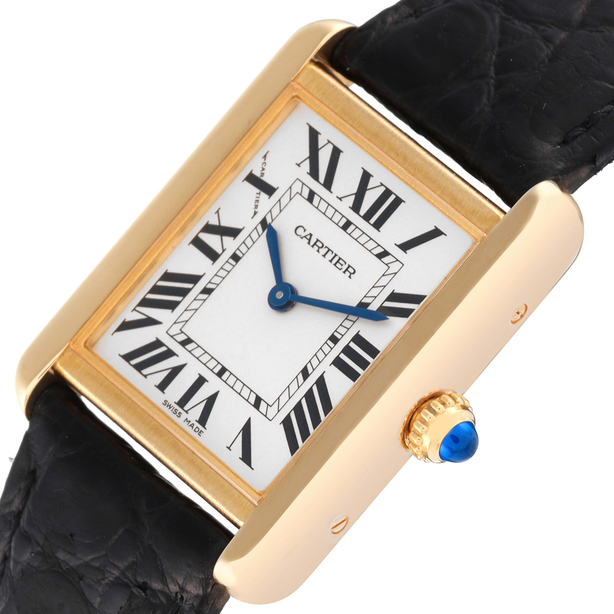 This image shows a close-up of the Cartier Tank Solo W5200002 Women's Yellow Gold Silver Dial W5200002 Women's Yellow Gold Silver Dial watch, highlighting the dial, casing, and crown with a blue cabochon.
