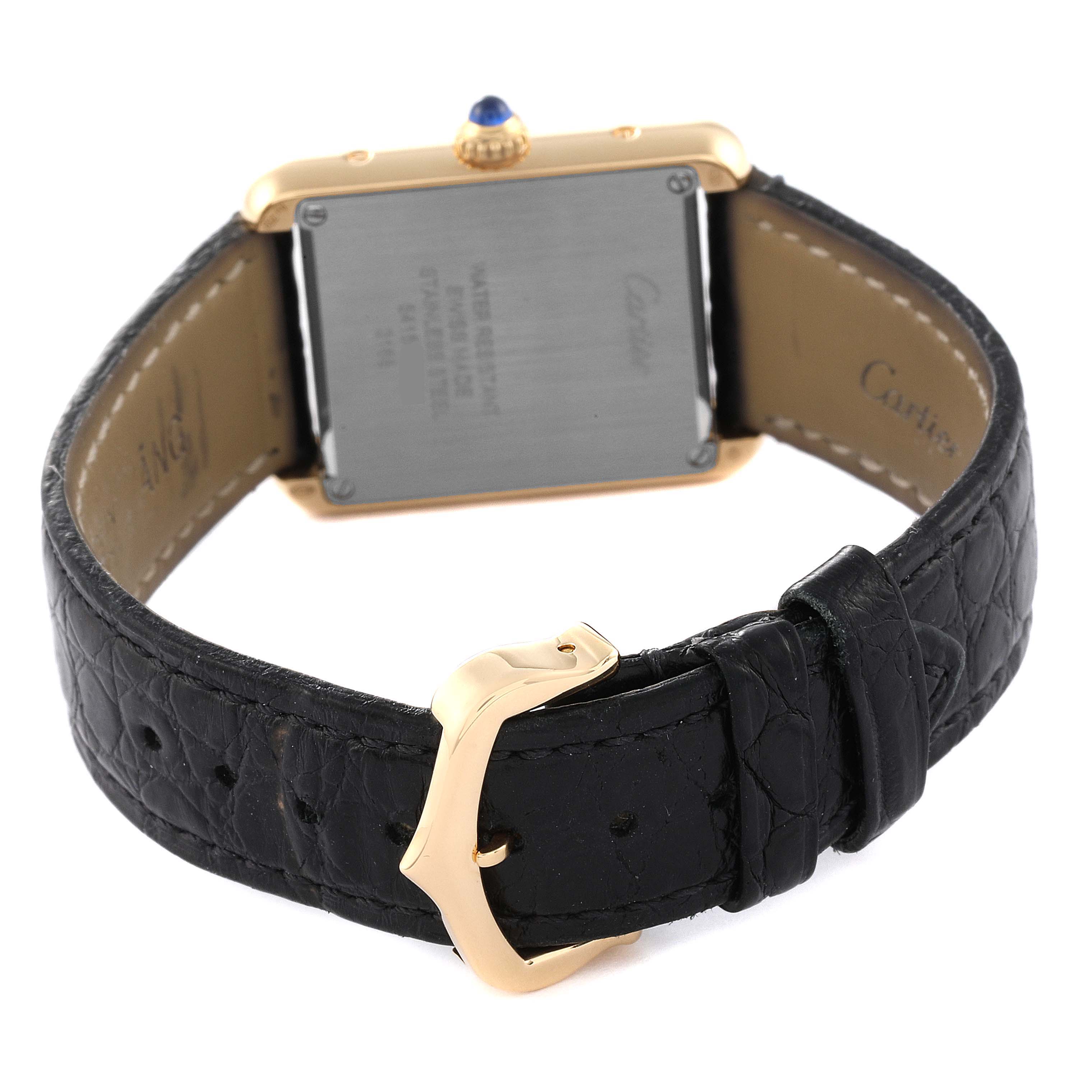 This image shows the back view of a Cartier Tank Solo W5200002 Women's Yellow Gold Silver Dial W5200002 Women's Yellow Gold Silver Dial watch, including its black leather strap with a gold buckle.